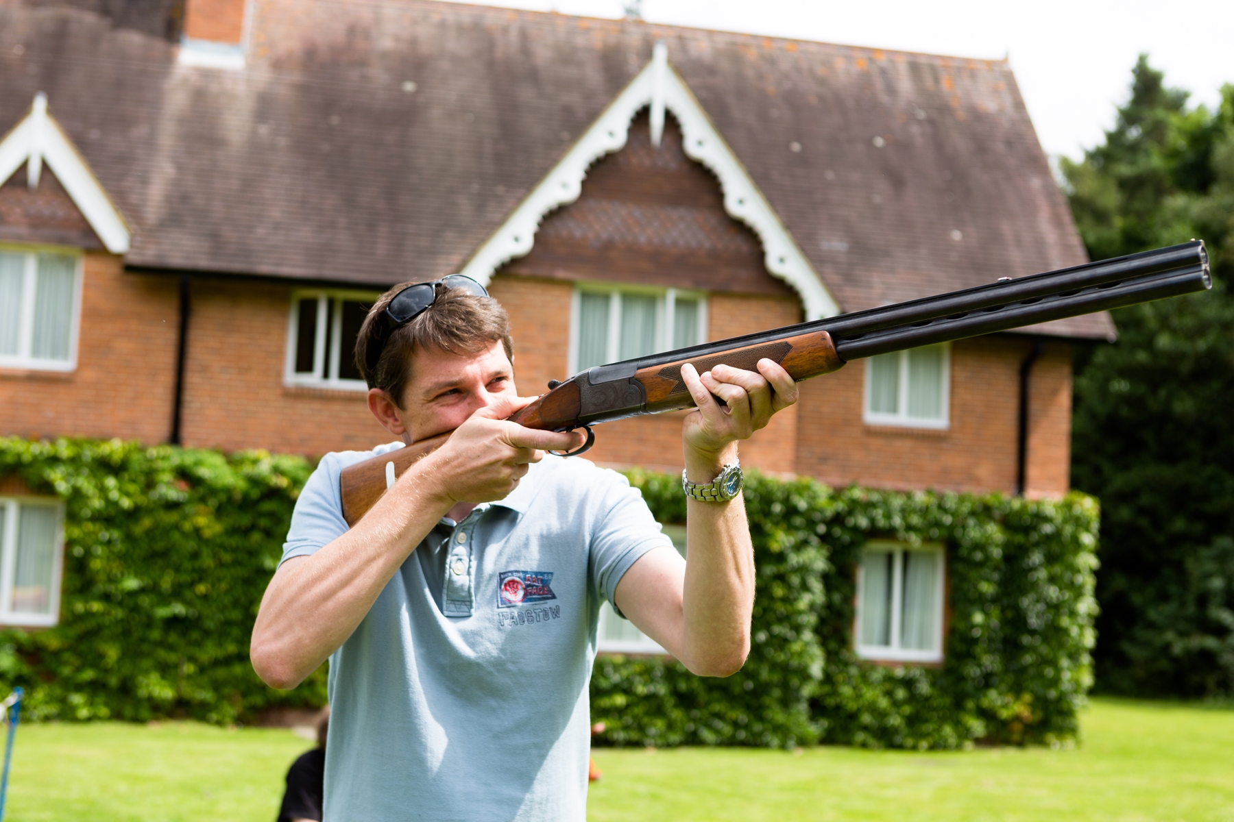 Participant shooting in Garden Pavilion, Audleys Wood Hotel for team-building event.