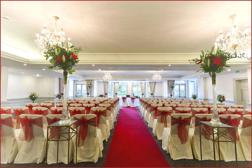 Prince of Wales Suite at Woodlands Park Hotel, elegant wedding venue with floral centerpieces.