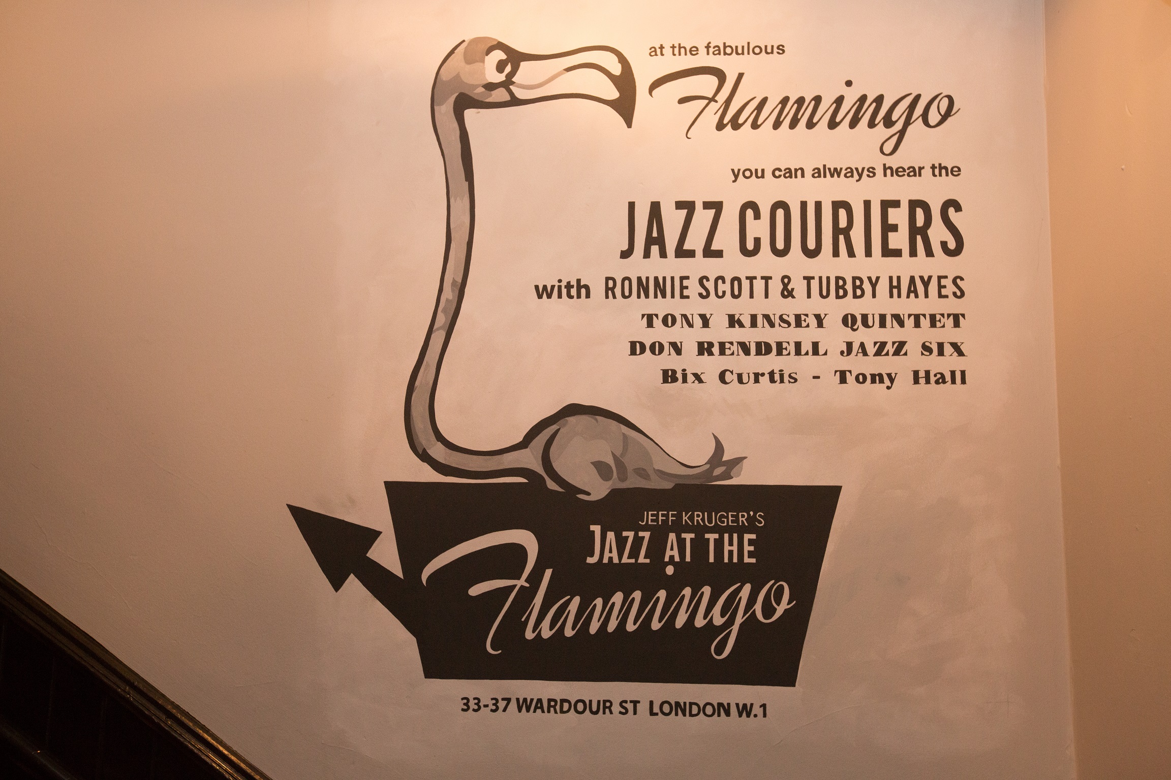 Vintage poster for "Jazz at the Flamingo" event, featuring a playful flamingo graphic.