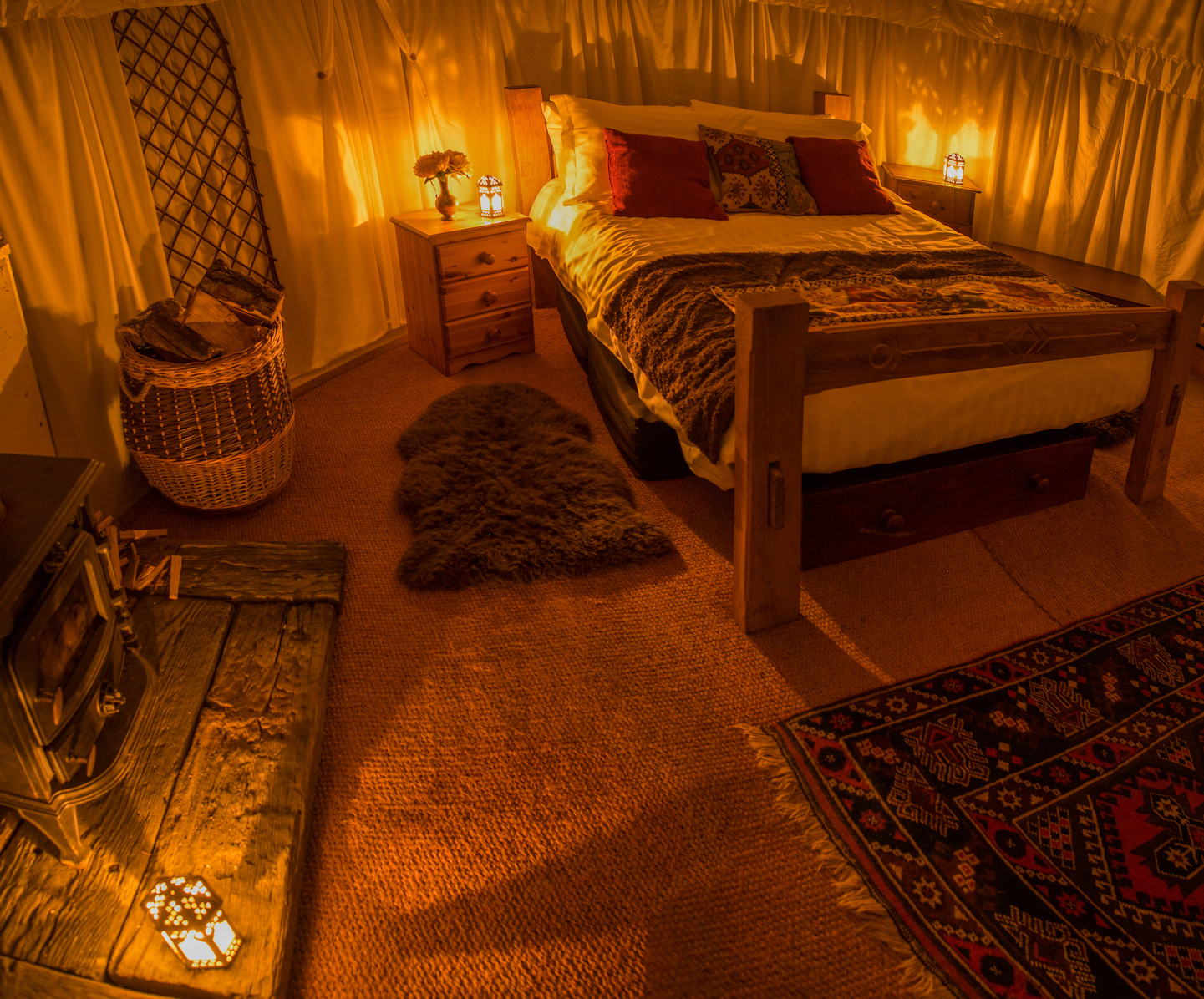 Cozy glamping venue with warm lighting for intimate retreats and wellness events.