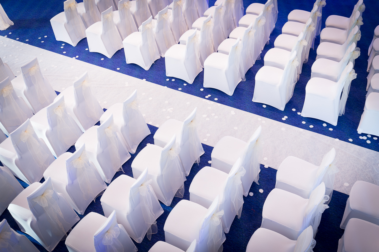 Barbirolli Room seating arrangement with white chairs for weddings and formal events.