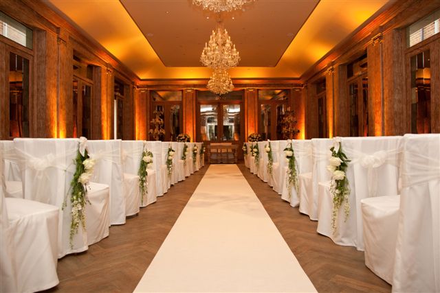 Elegant wedding ceremony setup in The Saunders Room, Fawsley Hall Hotel & Spa.