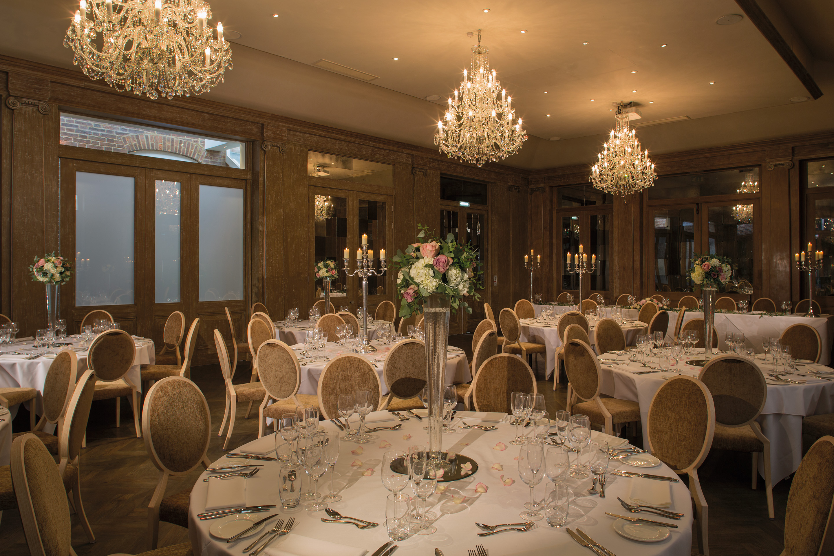 Elegant banquet hall at Fawsley Hall, perfect for weddings and corporate events.