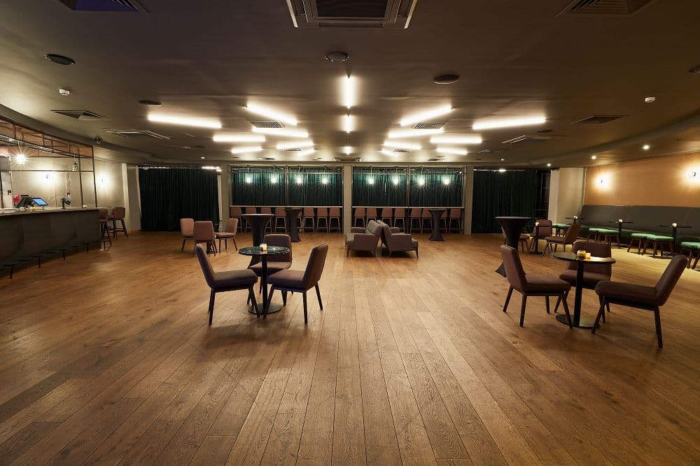Vue West End lounge with café seating, ideal for corporate event breakout sessions and receptions.