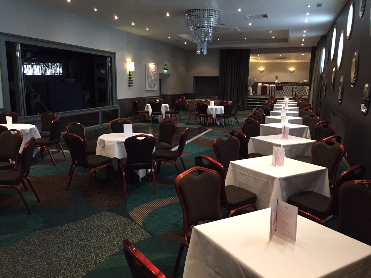 Grand Suite at Grand Jersey Hotel, elegant meeting space with soft lighting for events.