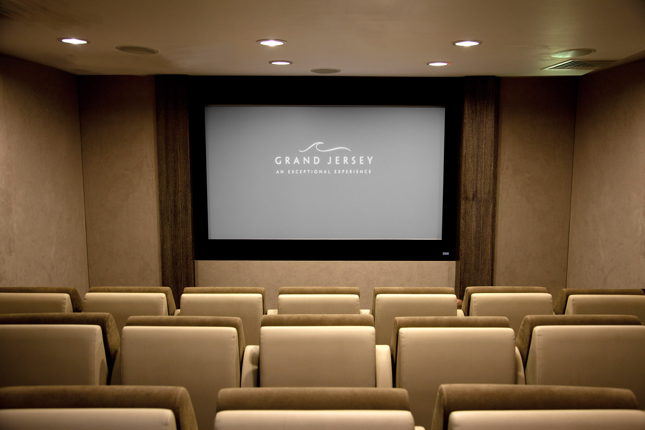 Modern screening room at Grand Jersey Hotel & Spa for corporate events and private screenings.