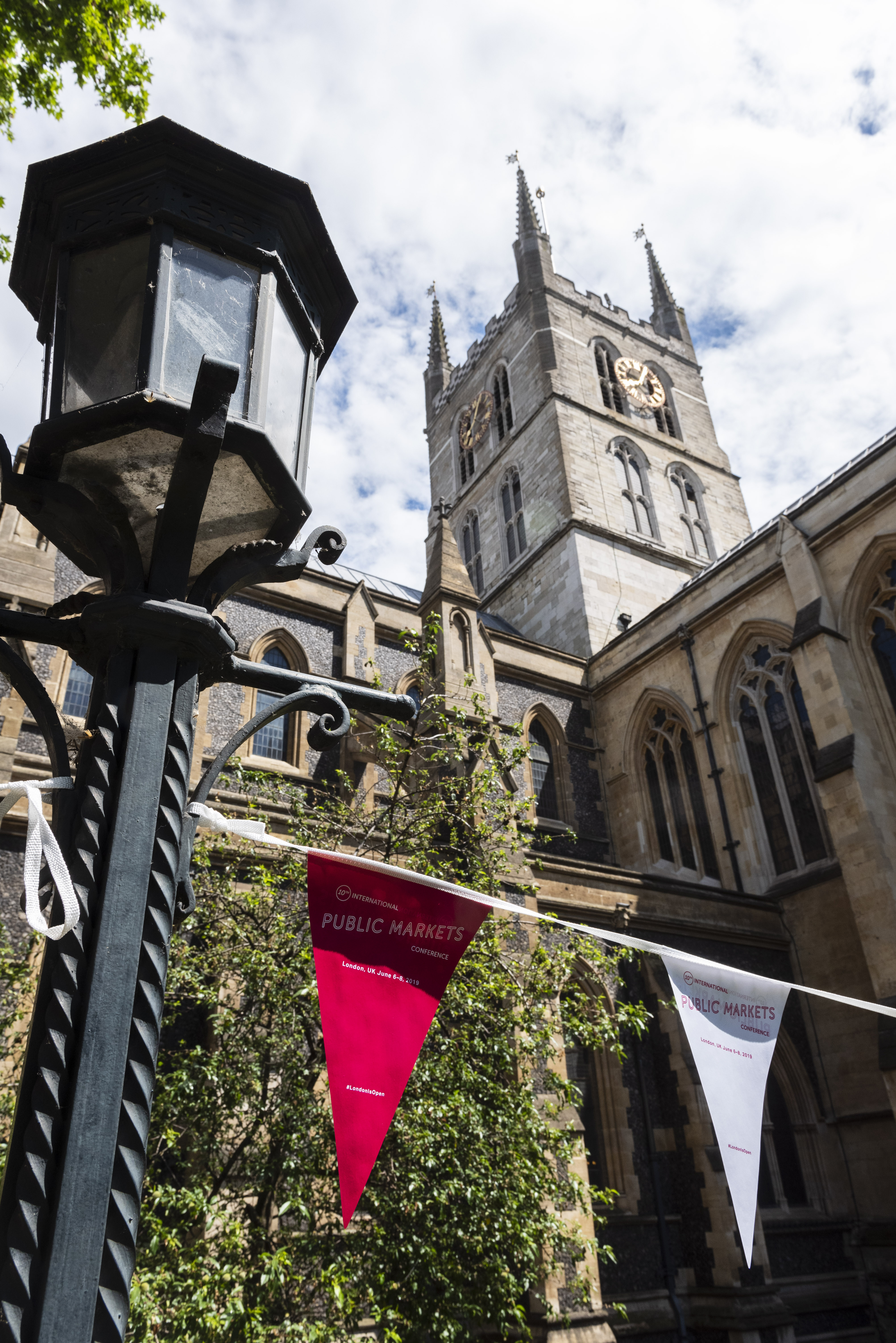 Southwark Cathedral Churchyard: historic venue with clock tower for events and markets.