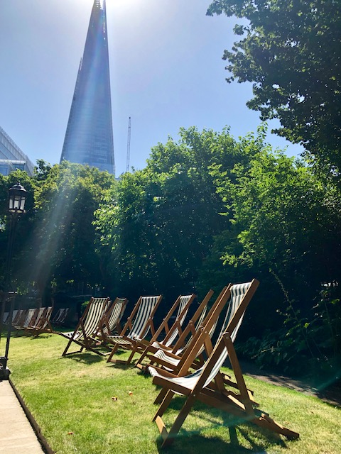 Southwark Cathedral Churchyard with deck chairs, ideal for networking events and relaxation.