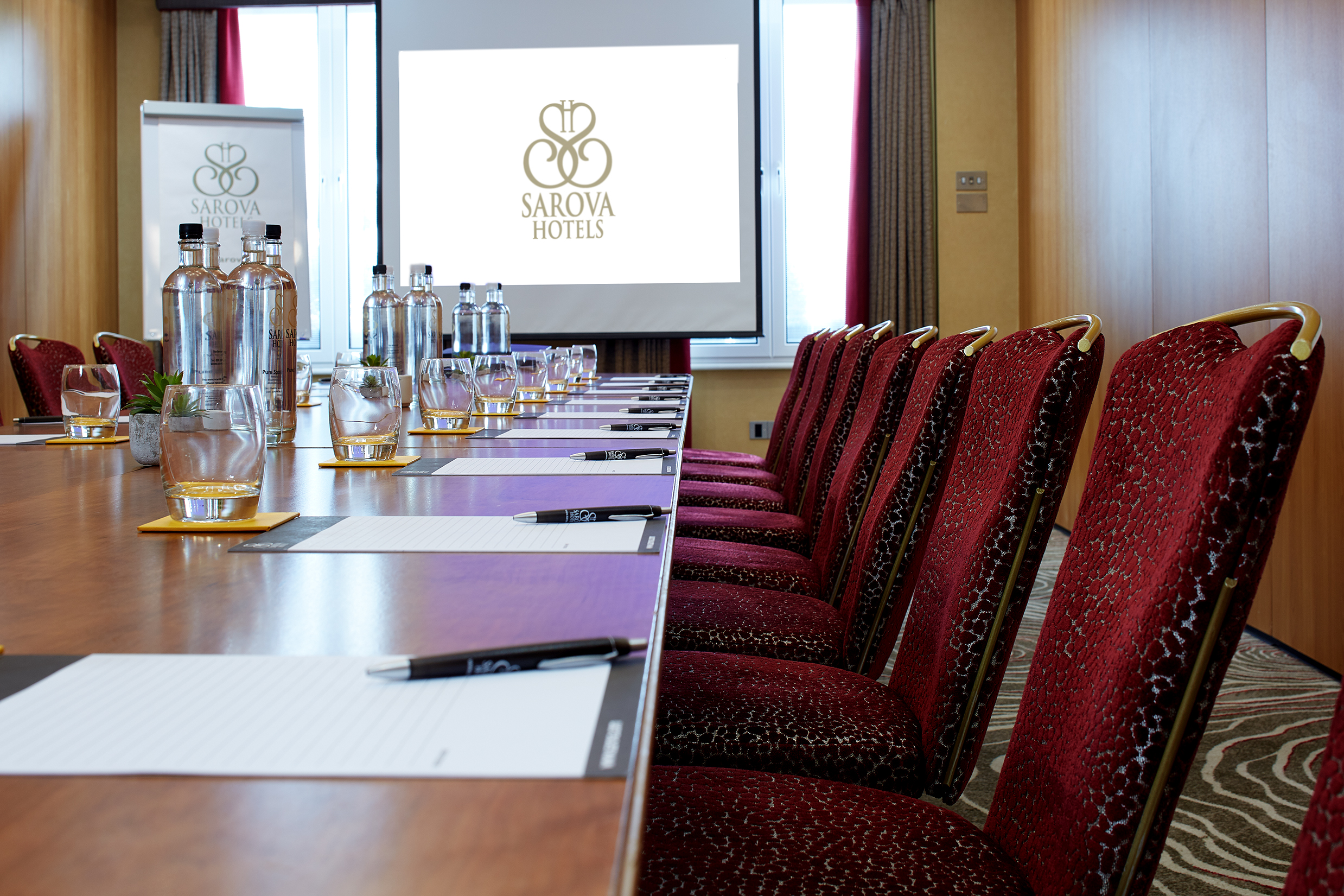 Edward Suite meeting room with projector for corporate events and workshops.