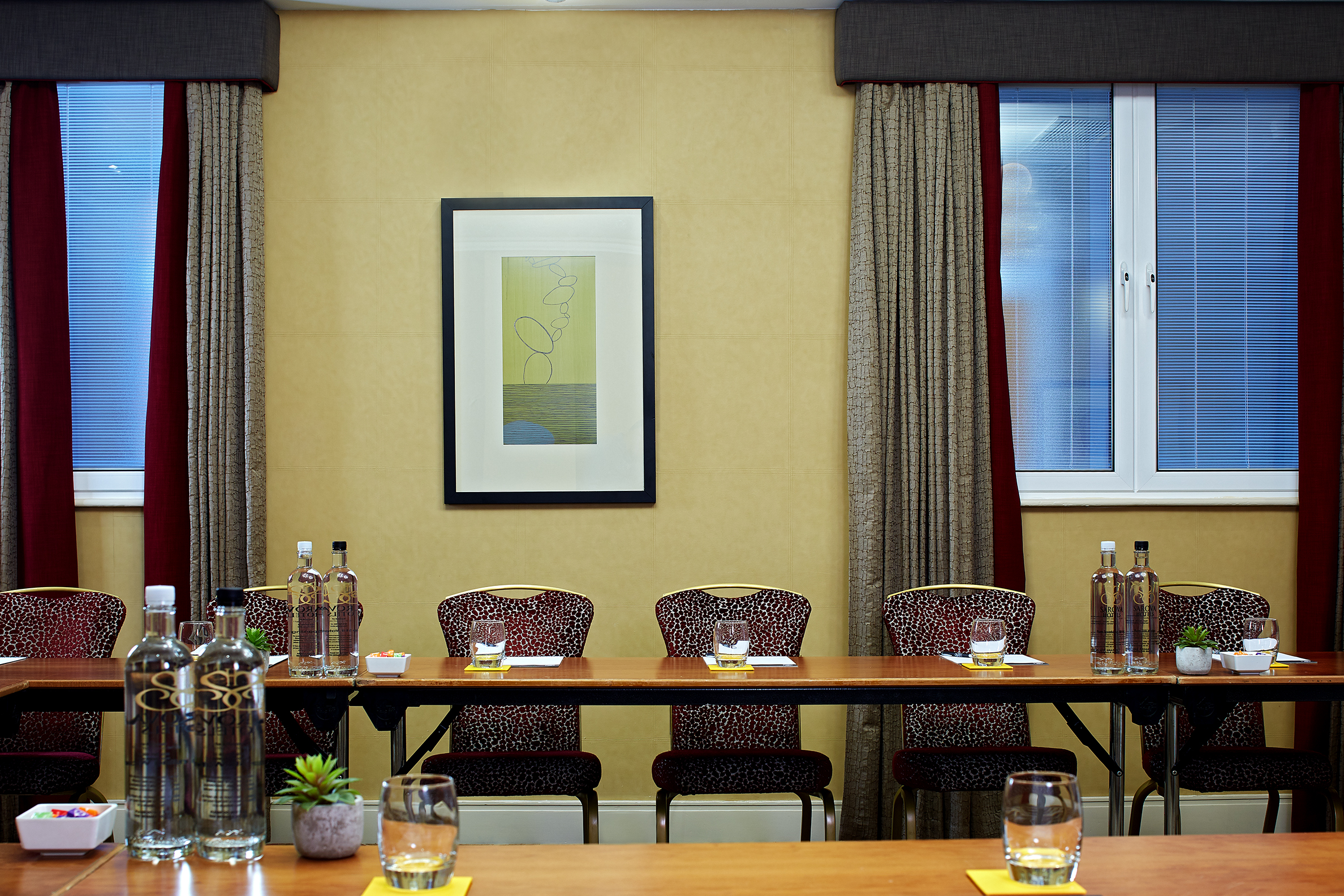 "Elizabeth suite meeting room with long table, ideal for workshops and discussions."