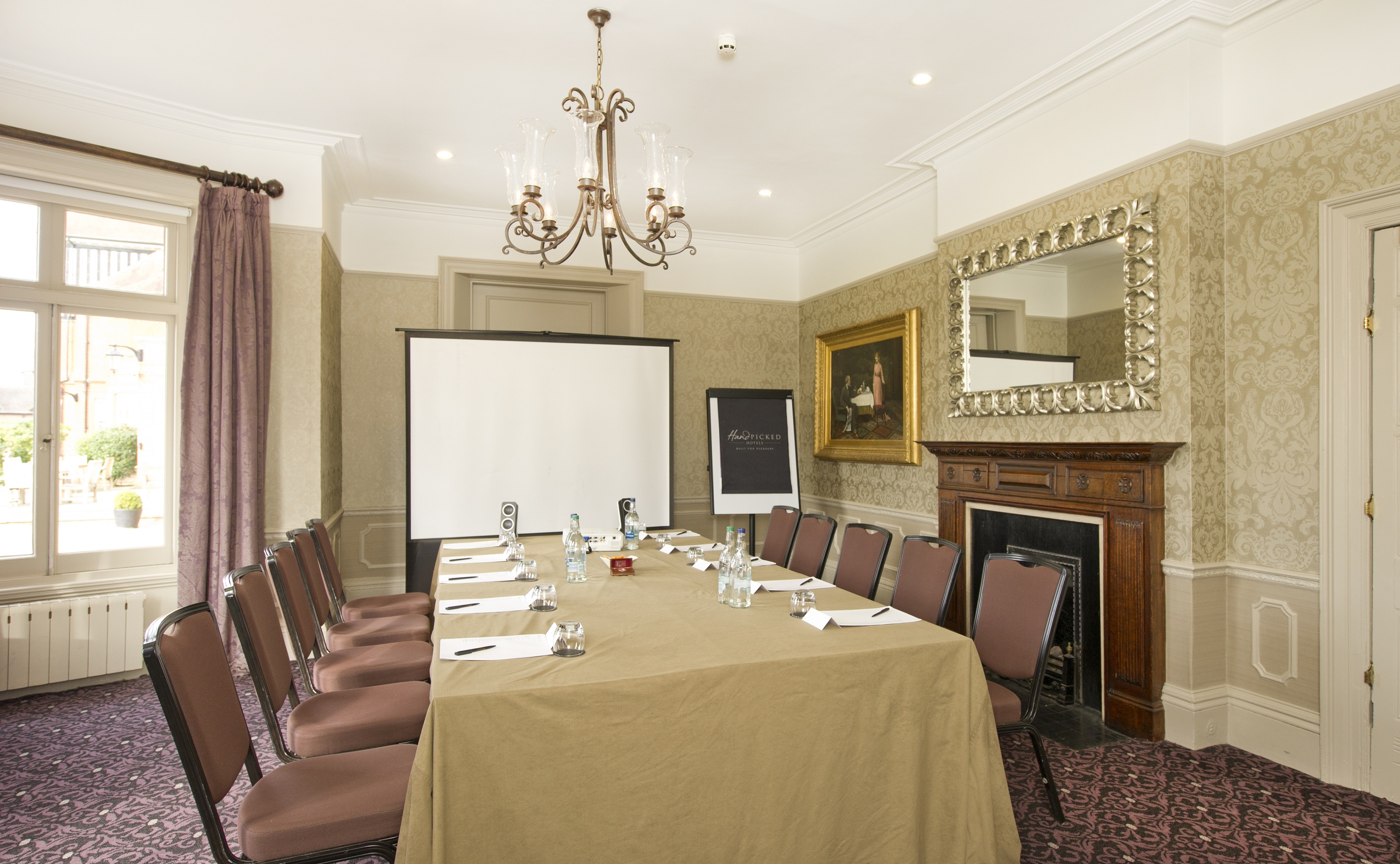 Meeting room at Woodlands Park Hotel with elegant decor, ideal for professional gatherings.