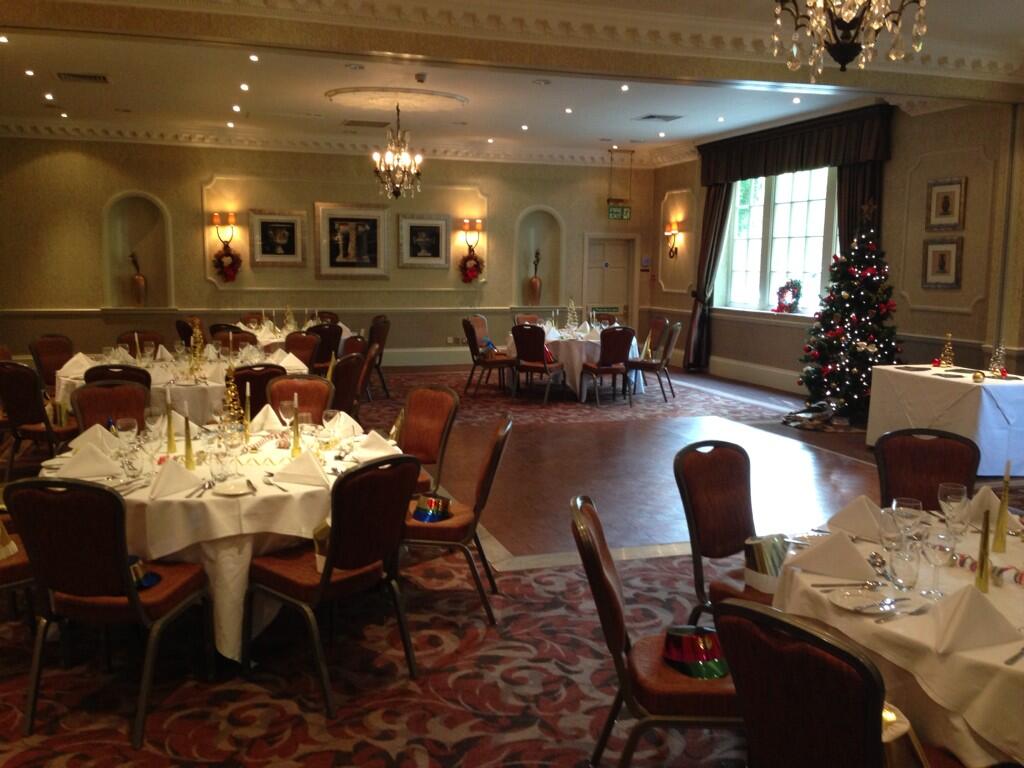 Elegant Vavasour Suite banquet room with festive decor for holiday events and corporate functions.
