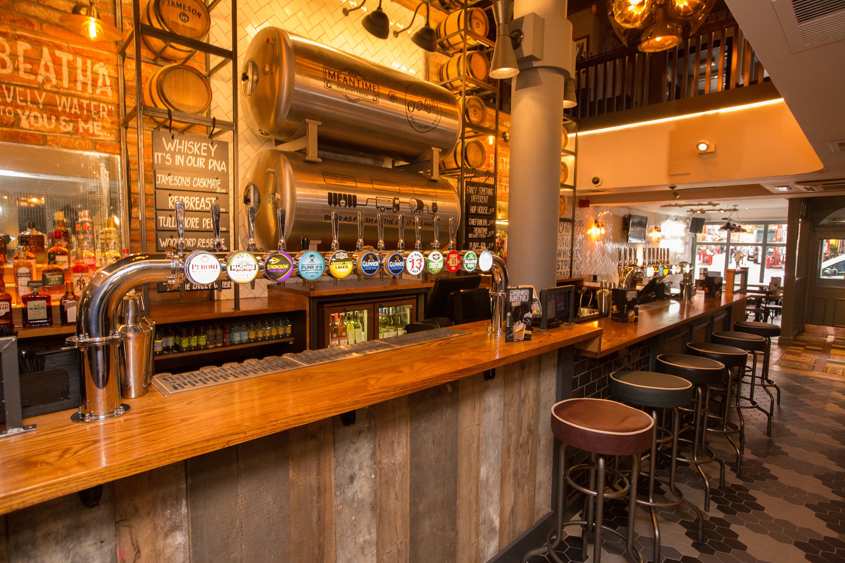 Stylish bar at O'Neill's Wardour Street, ideal for networking and social gatherings.