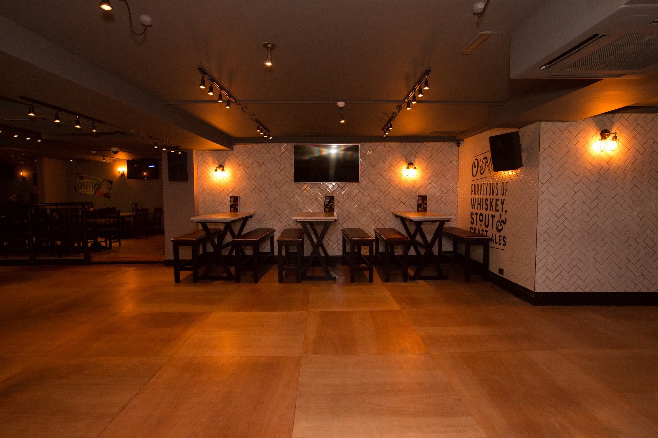 Flamingo Room at O'Neill's: modern event space with warm lighting for networking and gatherings.