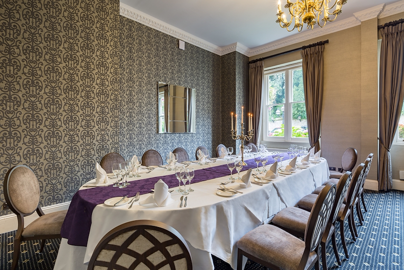 Elegant dining room at Nutfield Priory, perfect for corporate dinners and private events.
