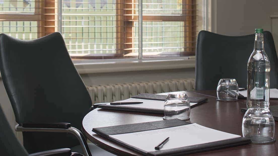 Kenley Room at Nutfield Priory: round table meeting space for productive sessions.