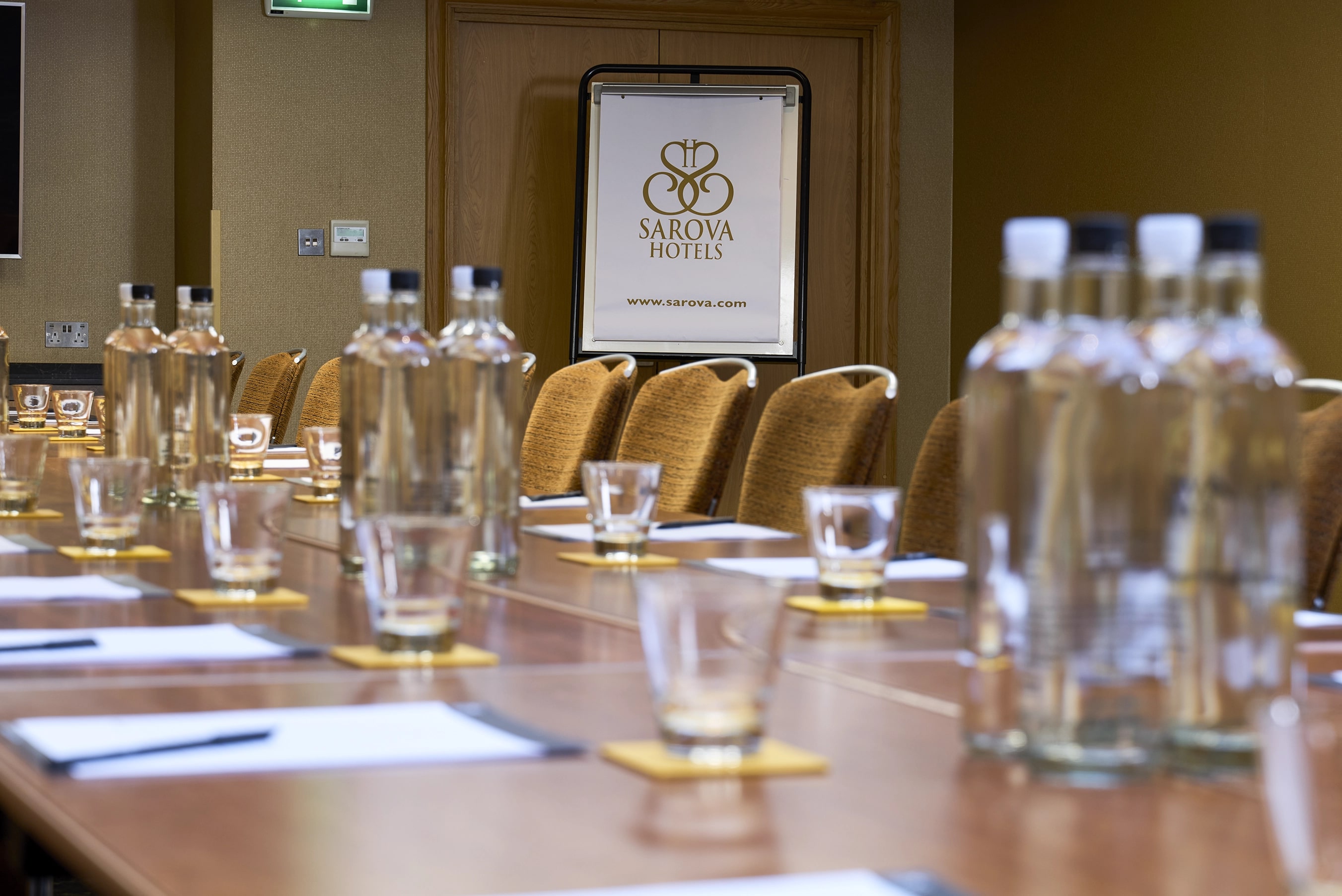 Buckingham Suite meeting room with polished table, ideal for corporate events.