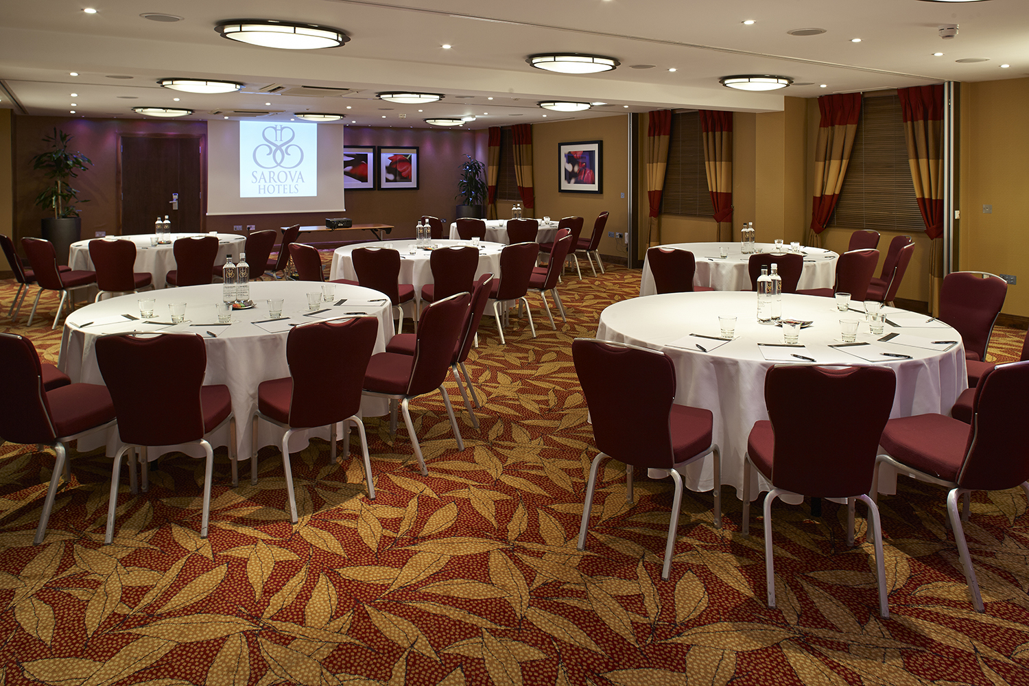 Chalfont Suite at The Bull Hotel: round tables set for professional workshops and networking.