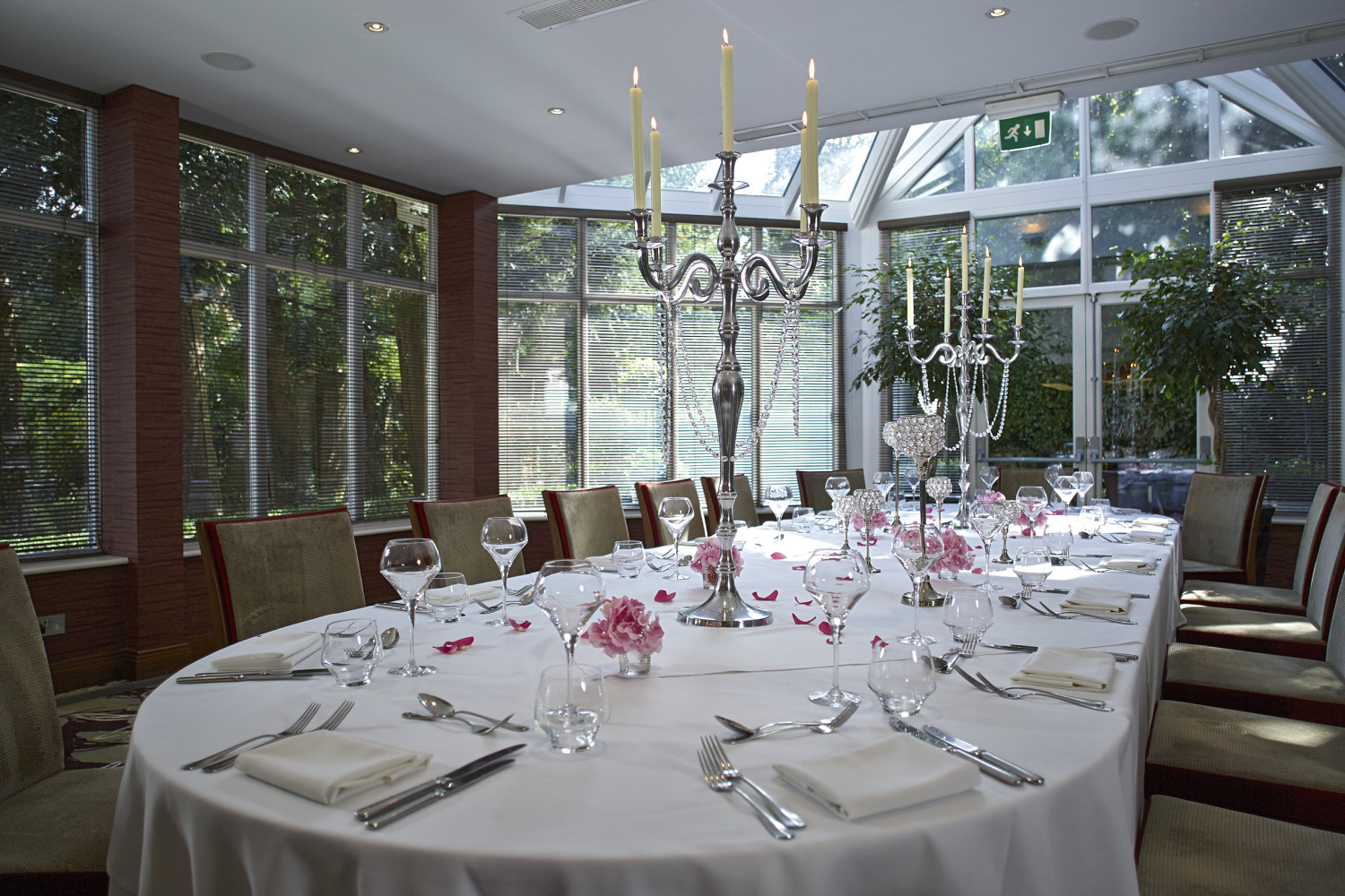 Elegant dining table in The Bull Hotel's Garden Room for upscale events.