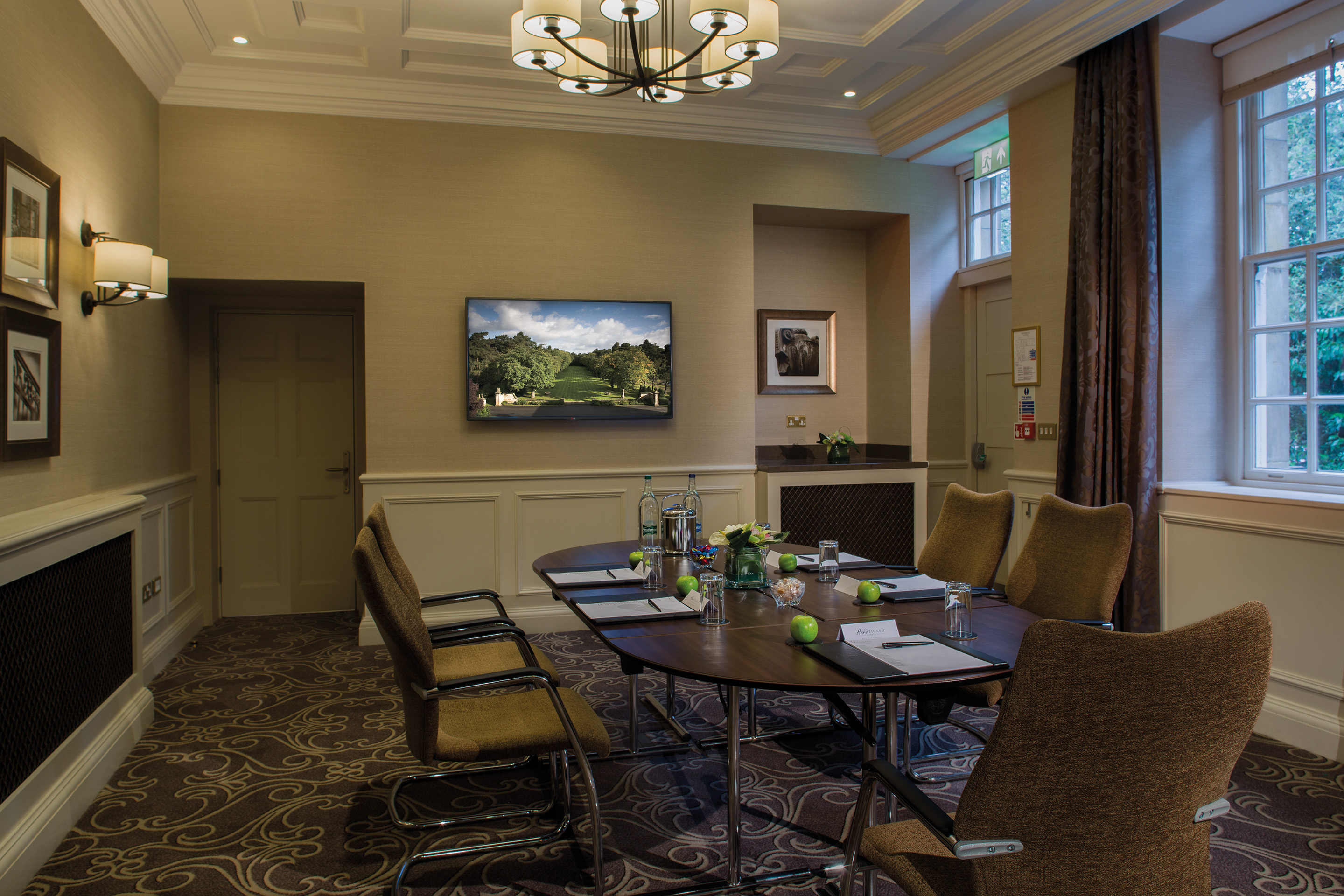 Meeting room at Crathorne Hall Hotel, featuring an oval table for professional gatherings.