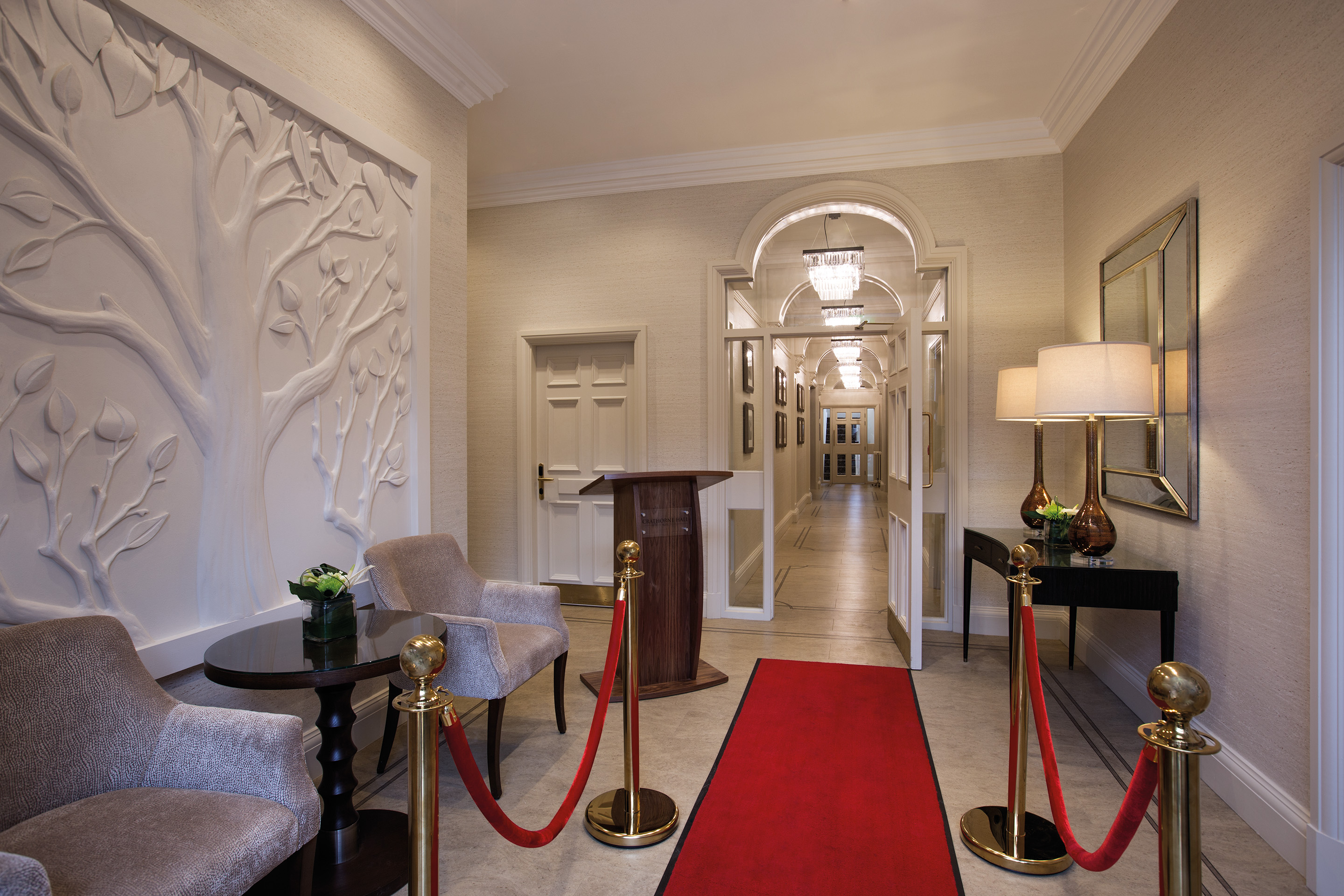 Elegant event entrance at Crathorne Hall Hotel with red carpet for upscale gatherings.