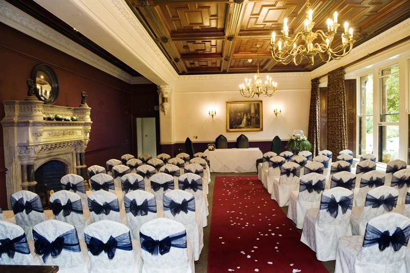 Elegant meeting space in Ettington Park Hotel with dark bow chairs, ideal for weddings and events.