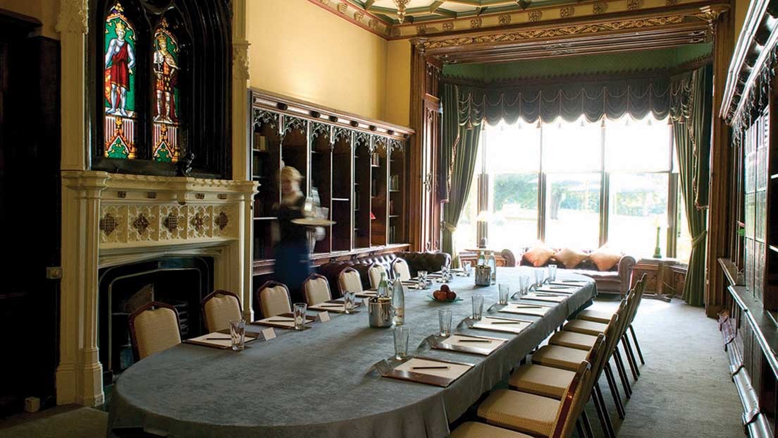 Elegant meeting room in Ettington Park Hotel with stained glass, perfect for corporate retreats.