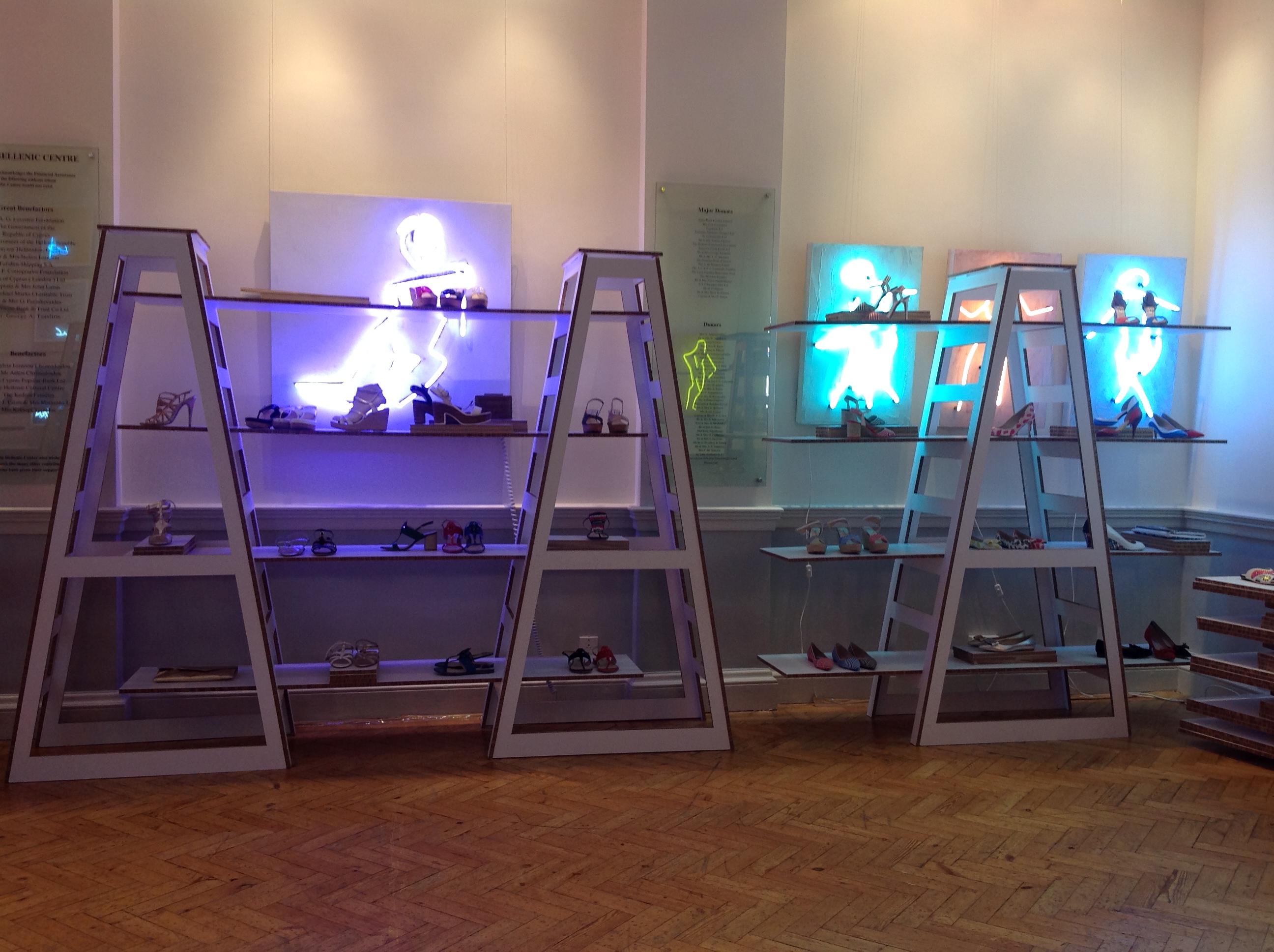 Stylish shoe display in modern shelving at The Hellenic Centre for fashion events.