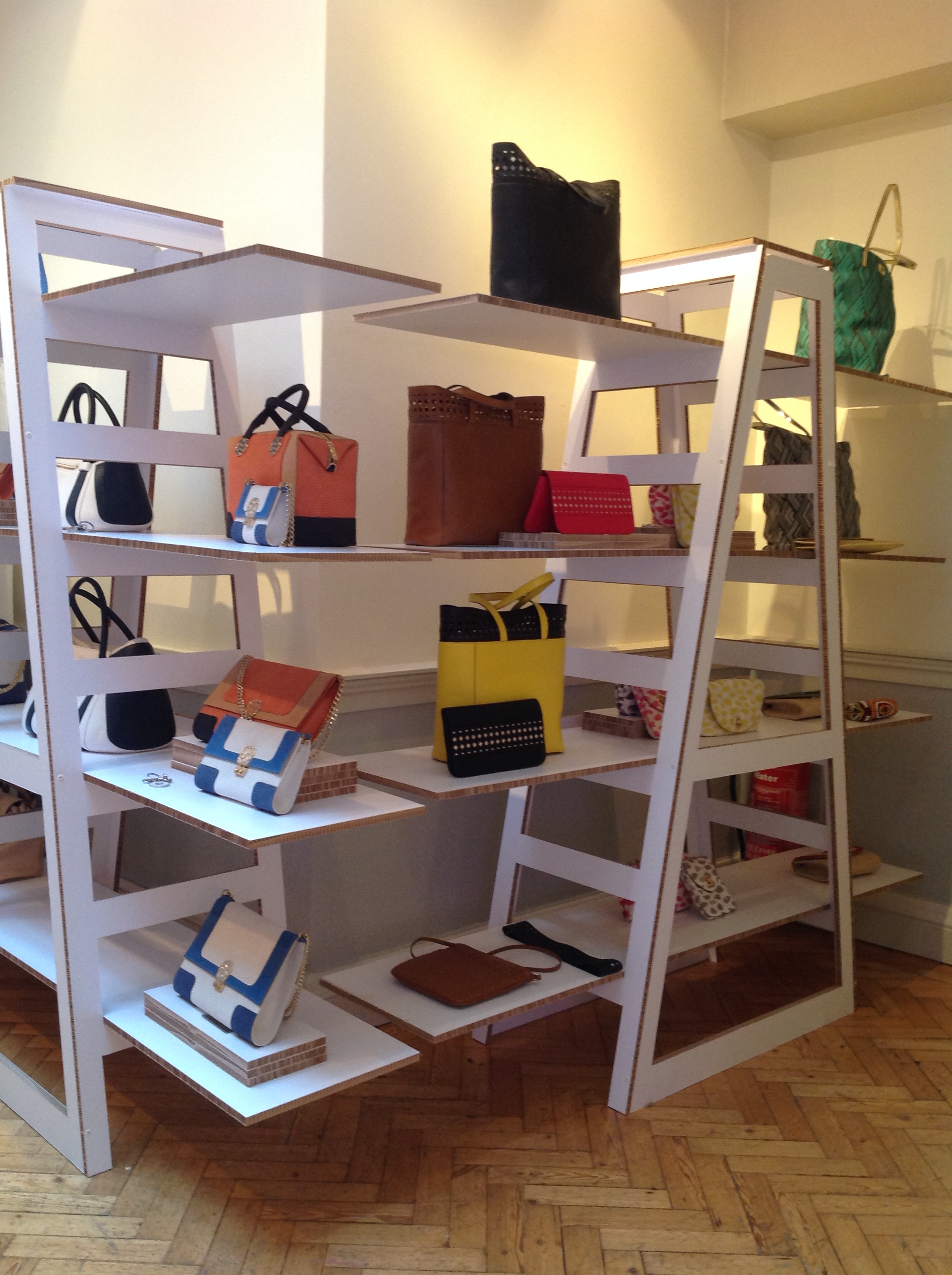 Stylish handbag display in Friends & Members Room for a fashion pop-up shop event.