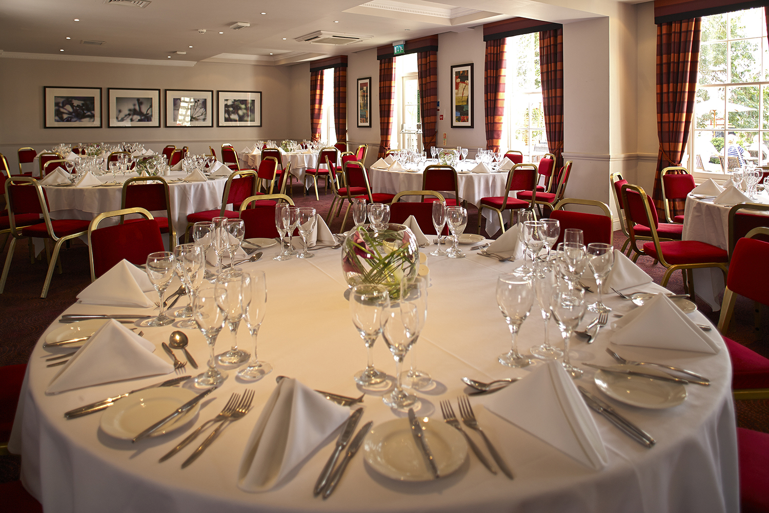 Elegant Princess Suite banquet setup with round tables, ideal for weddings and corporate events.