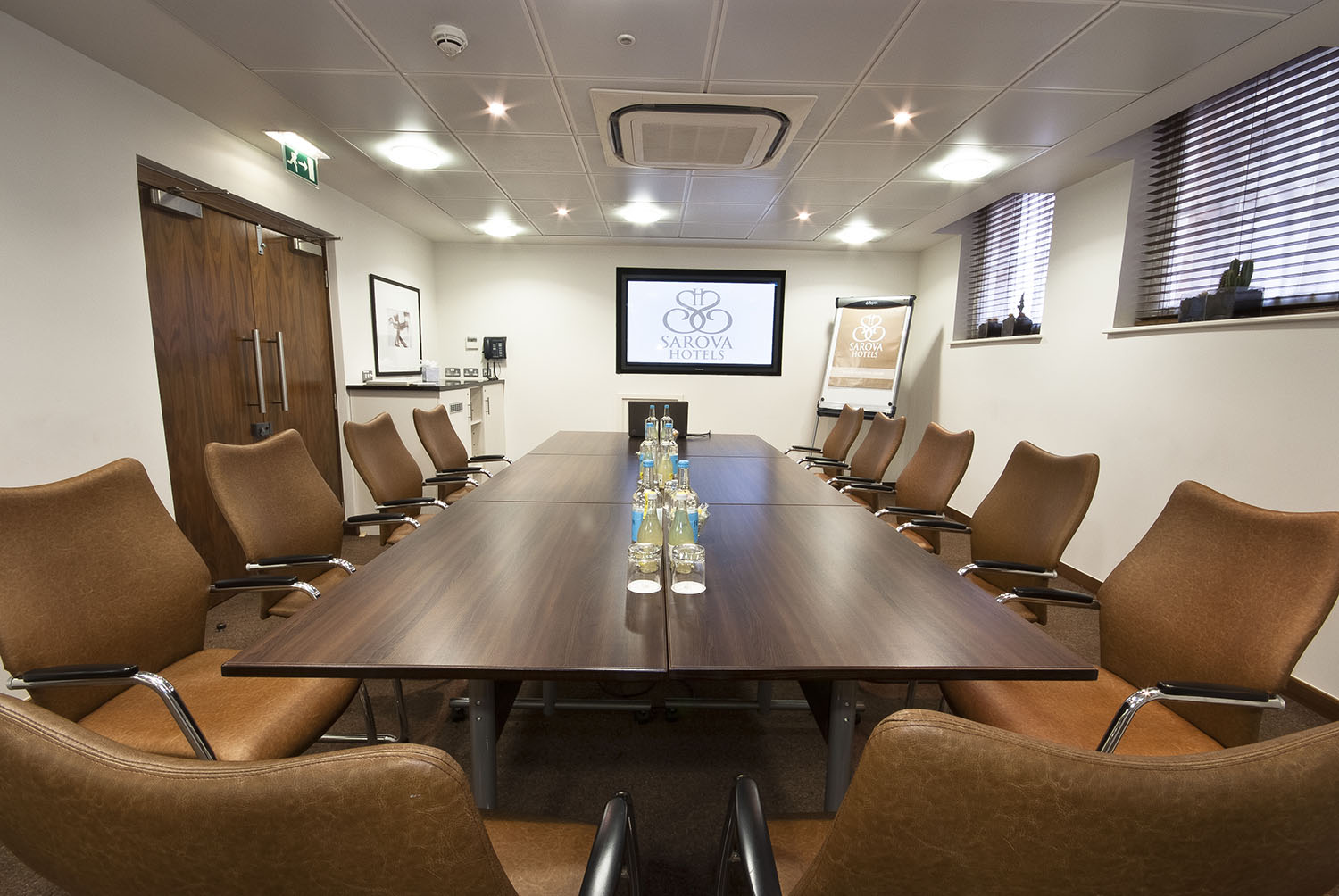 Balmoral Suite conference room with wooden table, ideal for meetings and presentations.