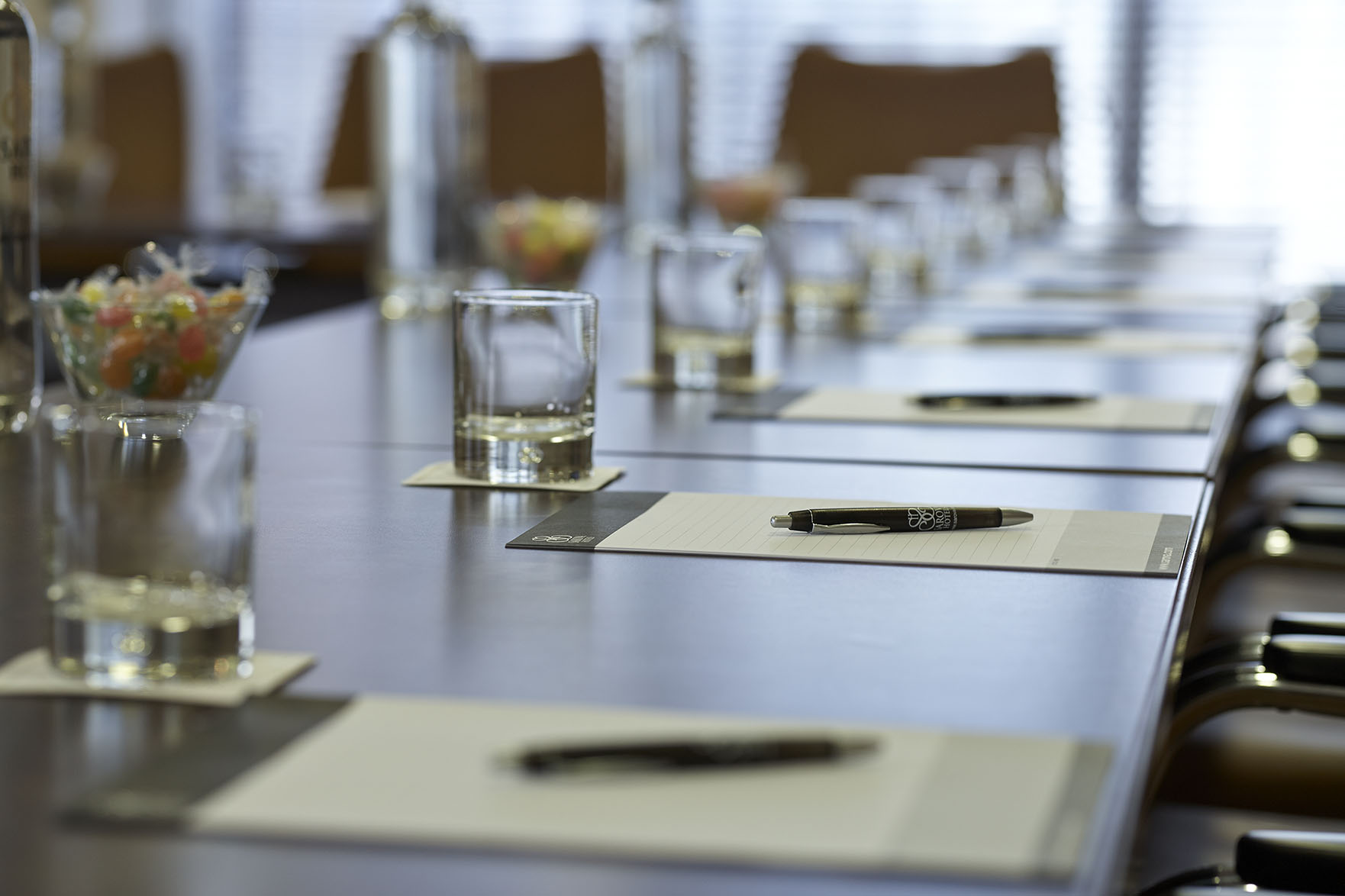 Sandringham Boardroom with long table, glassware; perfect for meetings and collaboration.