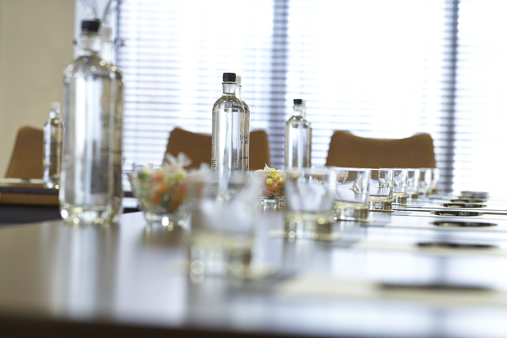 Sandringham Boardroom with long table, elegant glassware for meetings and events.