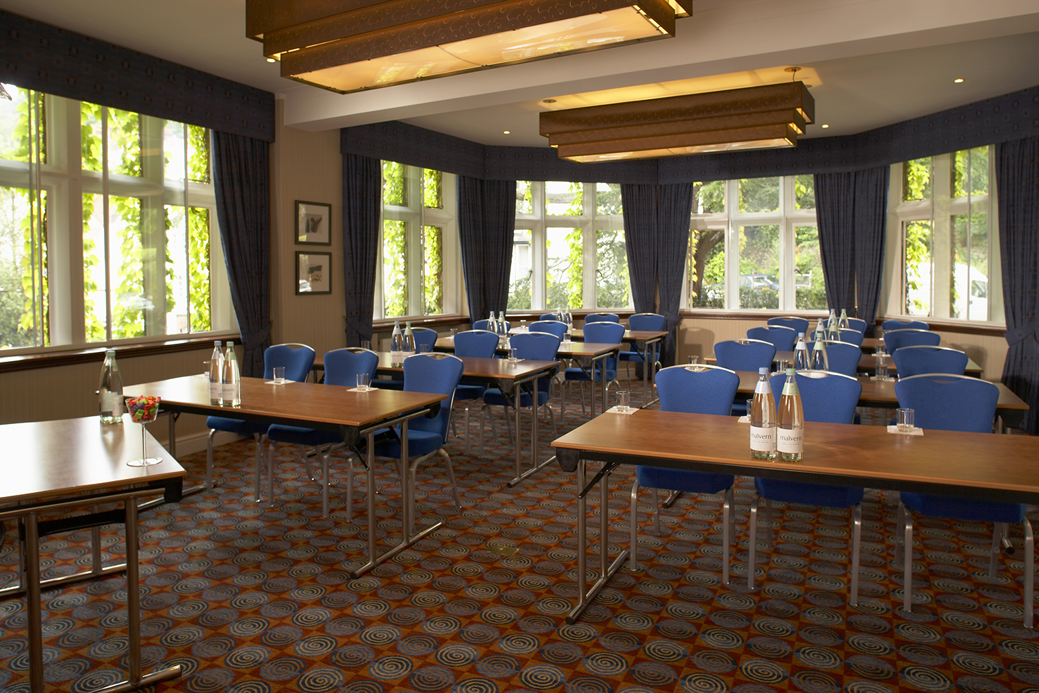 Worcester Suite meeting room with blue chairs, ideal for workshops and seminars.