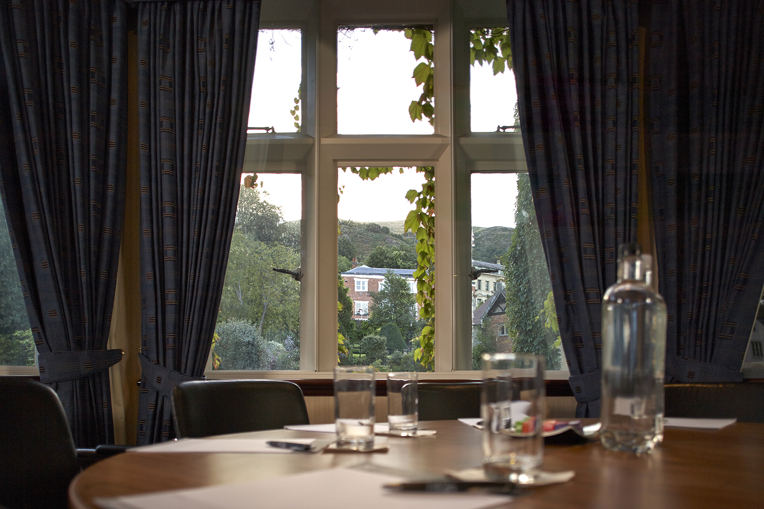 Elgar Suite meeting room with round table, ideal for corporate events and discussions.