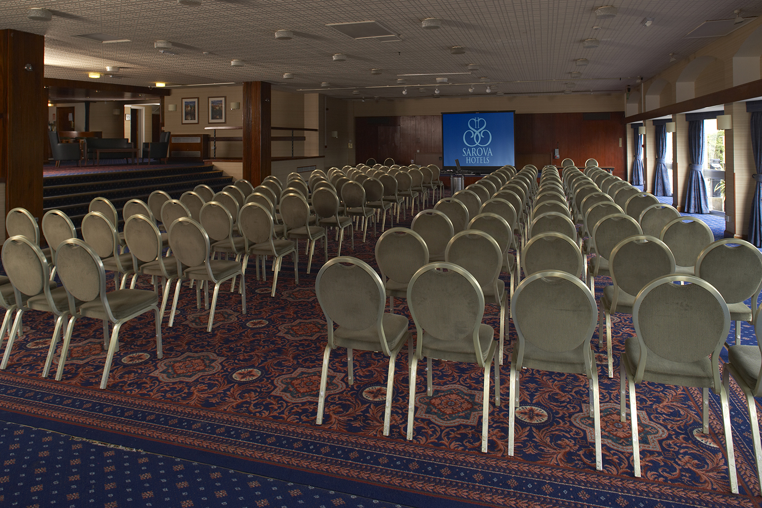 Elgar Suite conference setup with elegant decor and ample lighting for seminars.
