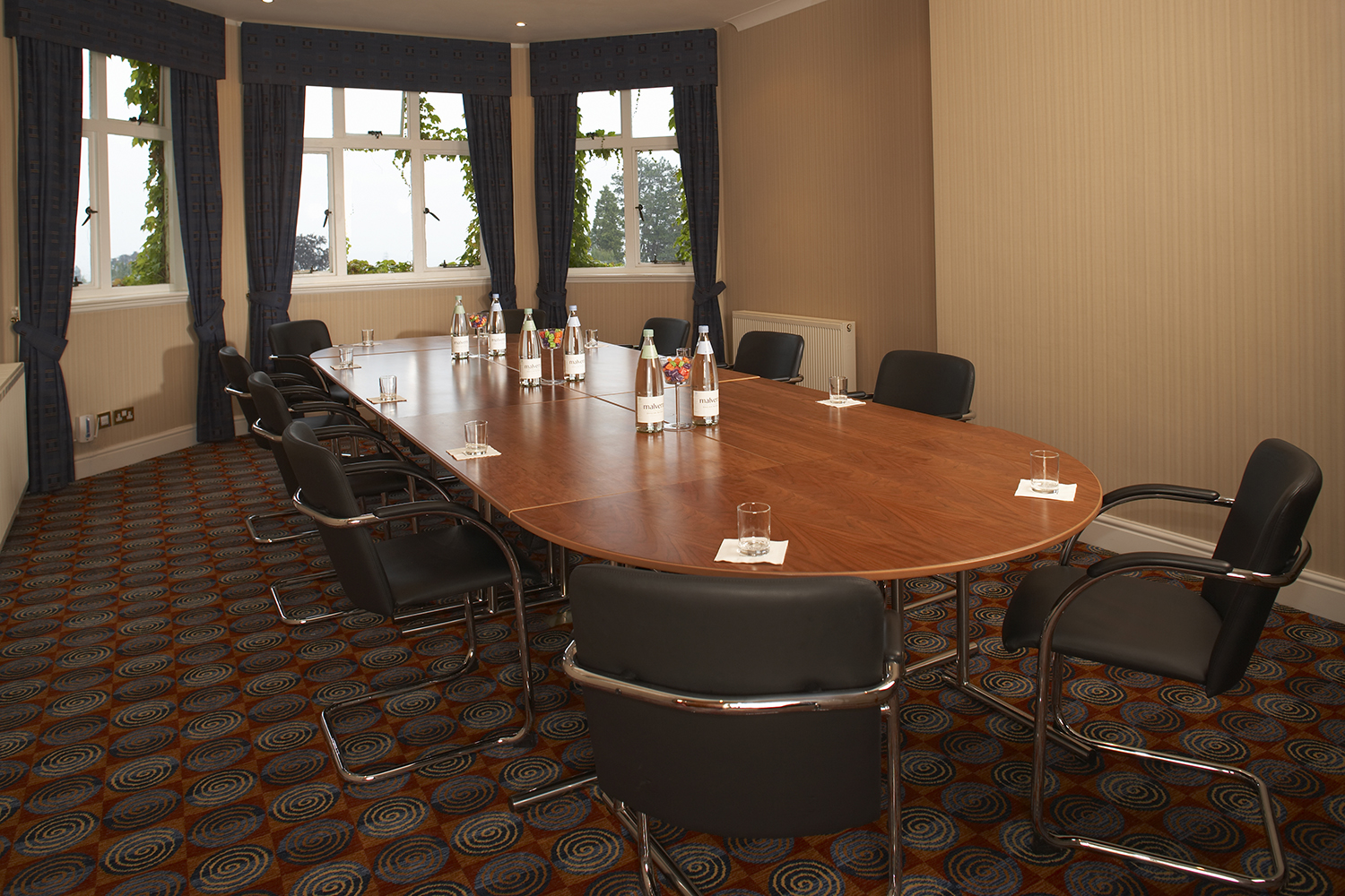 Montgomery Suite meeting room with oval table, ideal for professional gatherings and presentations.