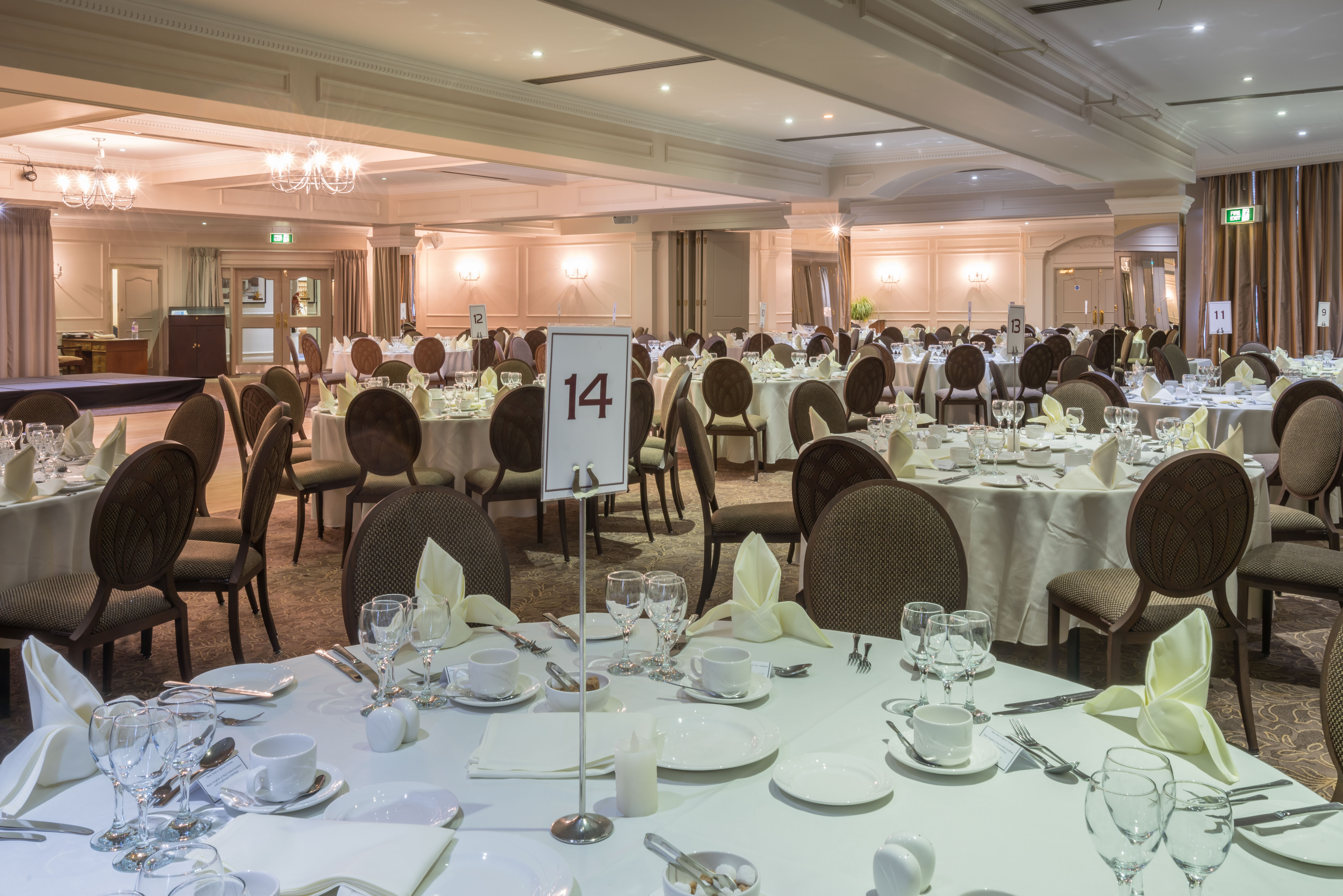 La Fontaine Suite banquet hall with elegant tables, ideal for corporate events and gatherings.
