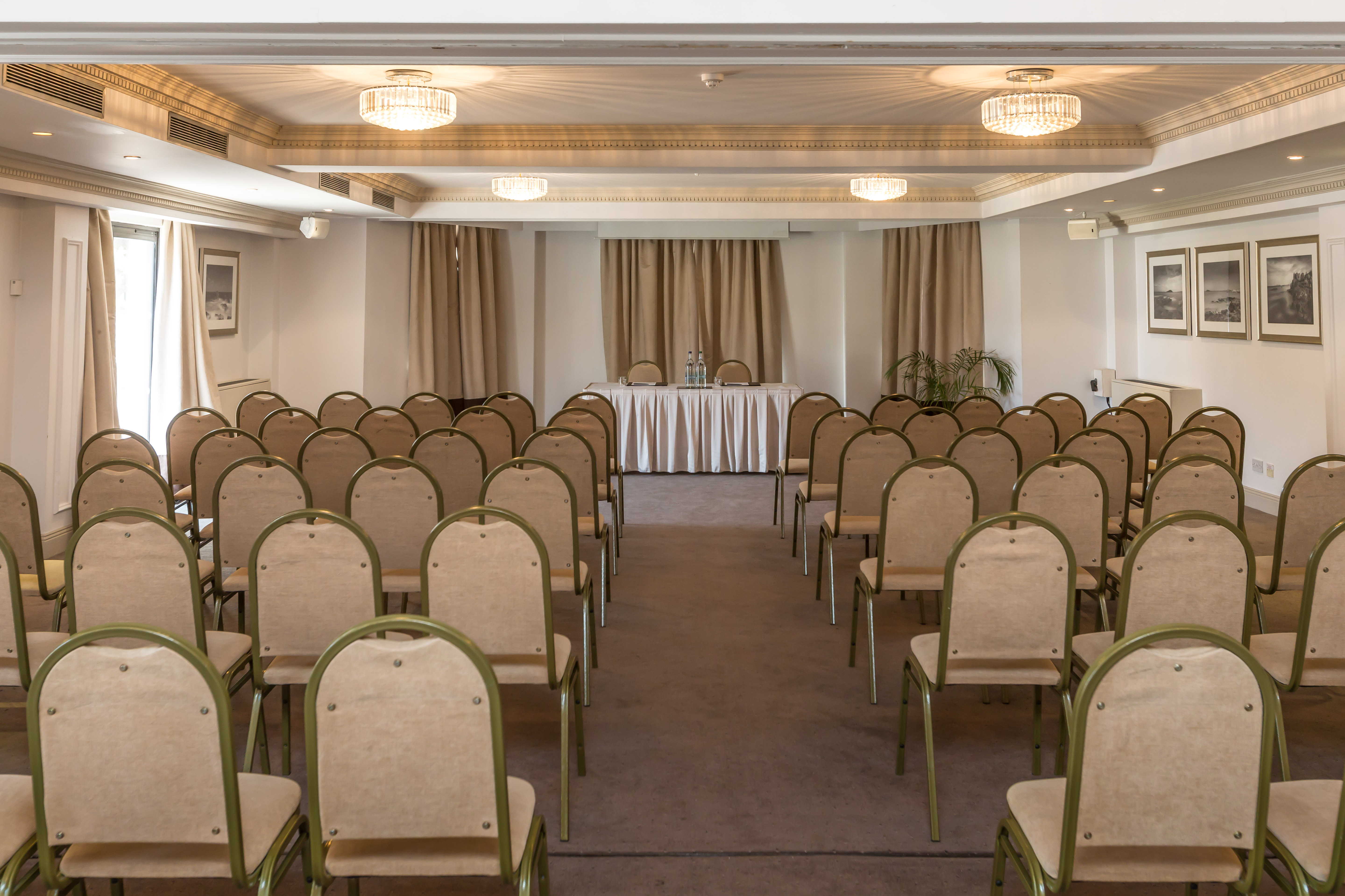 Victor Hugo Suite conference room with rows of chairs, ideal for presentations and meetings.