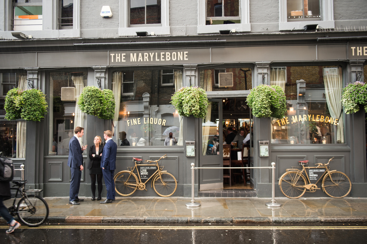 Charming pub venue with greenery, perfect for networking events and casual meetings.