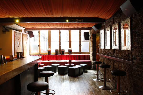 Versatile event space at Joe's Southern Table, featuring warm lighting and exposed brick.