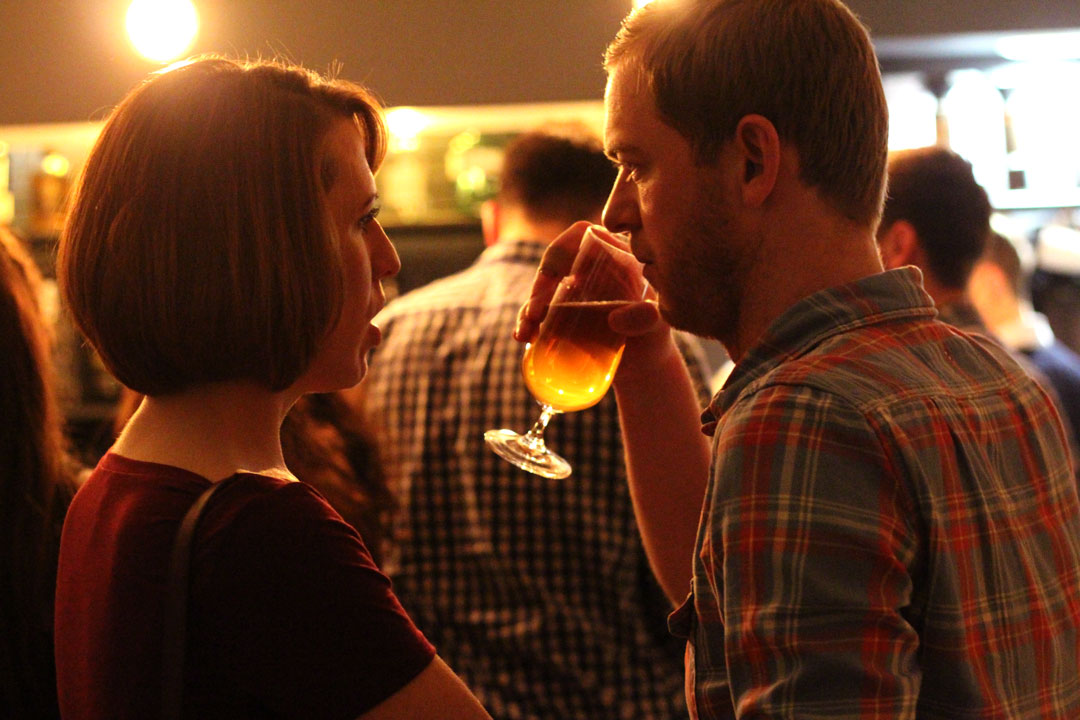 Vibrant networking event with attendees conversing in a relaxed atmosphere.