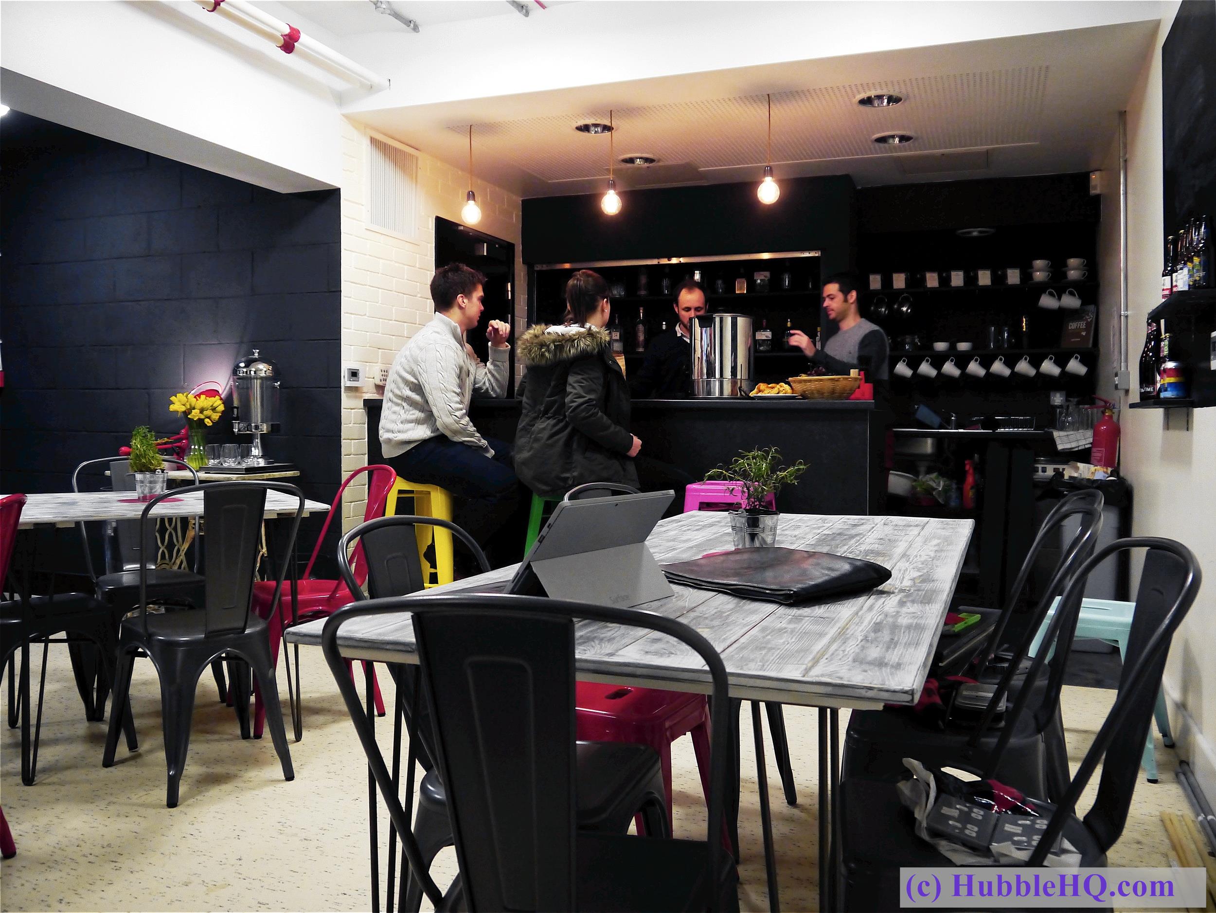 Vibrant café with colorful seating, ideal for networking and informal meetings.