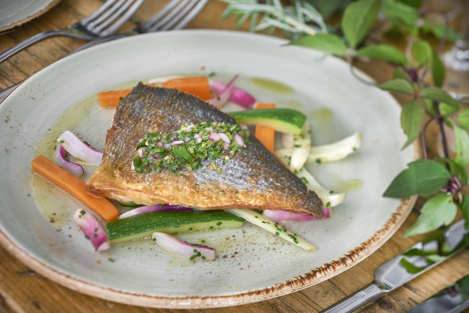 Private events space with beautifully plated fish dish, ideal for corporate gatherings.