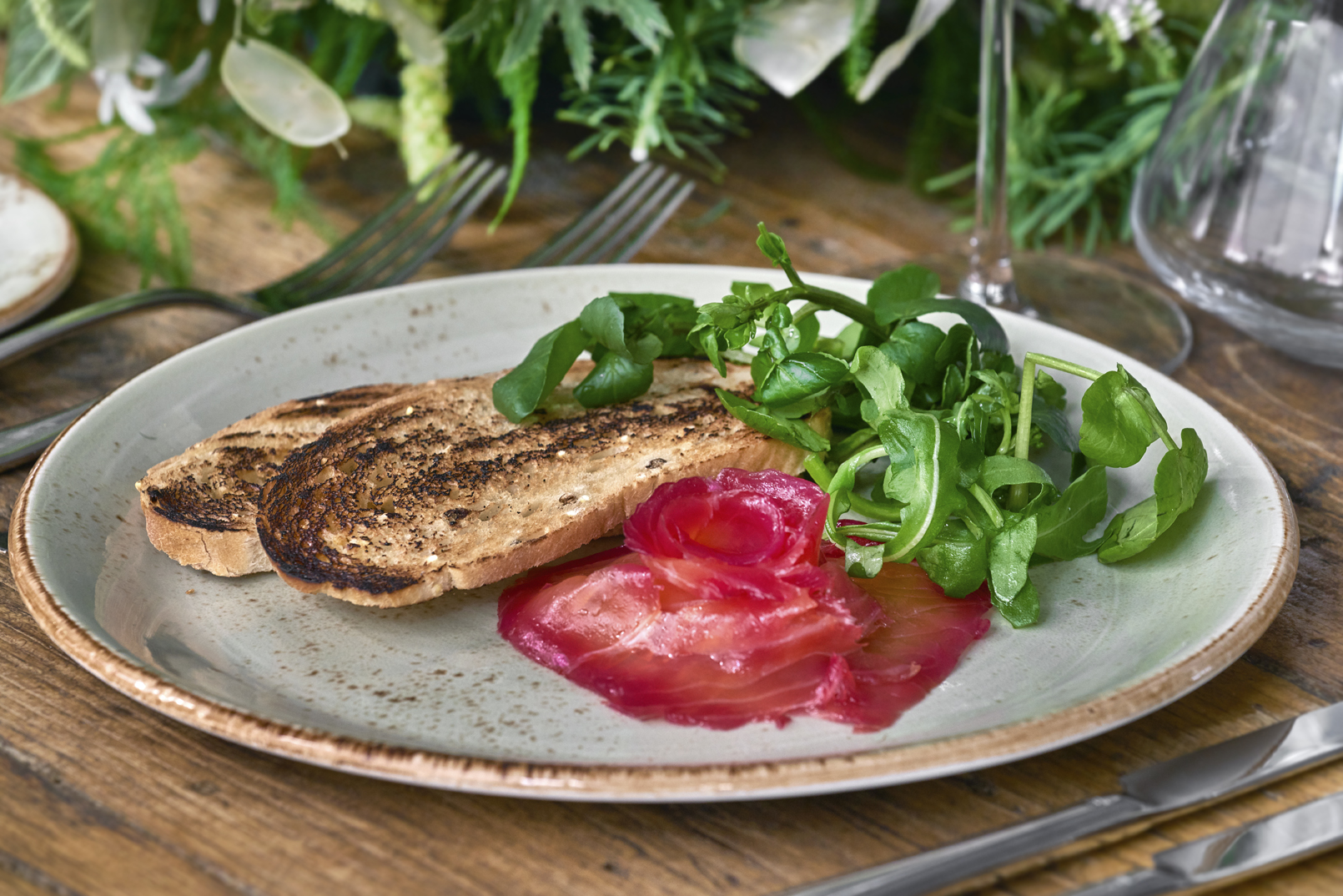 Private events space with gourmet dish of cured meat and fresh greens at Humble Grape.