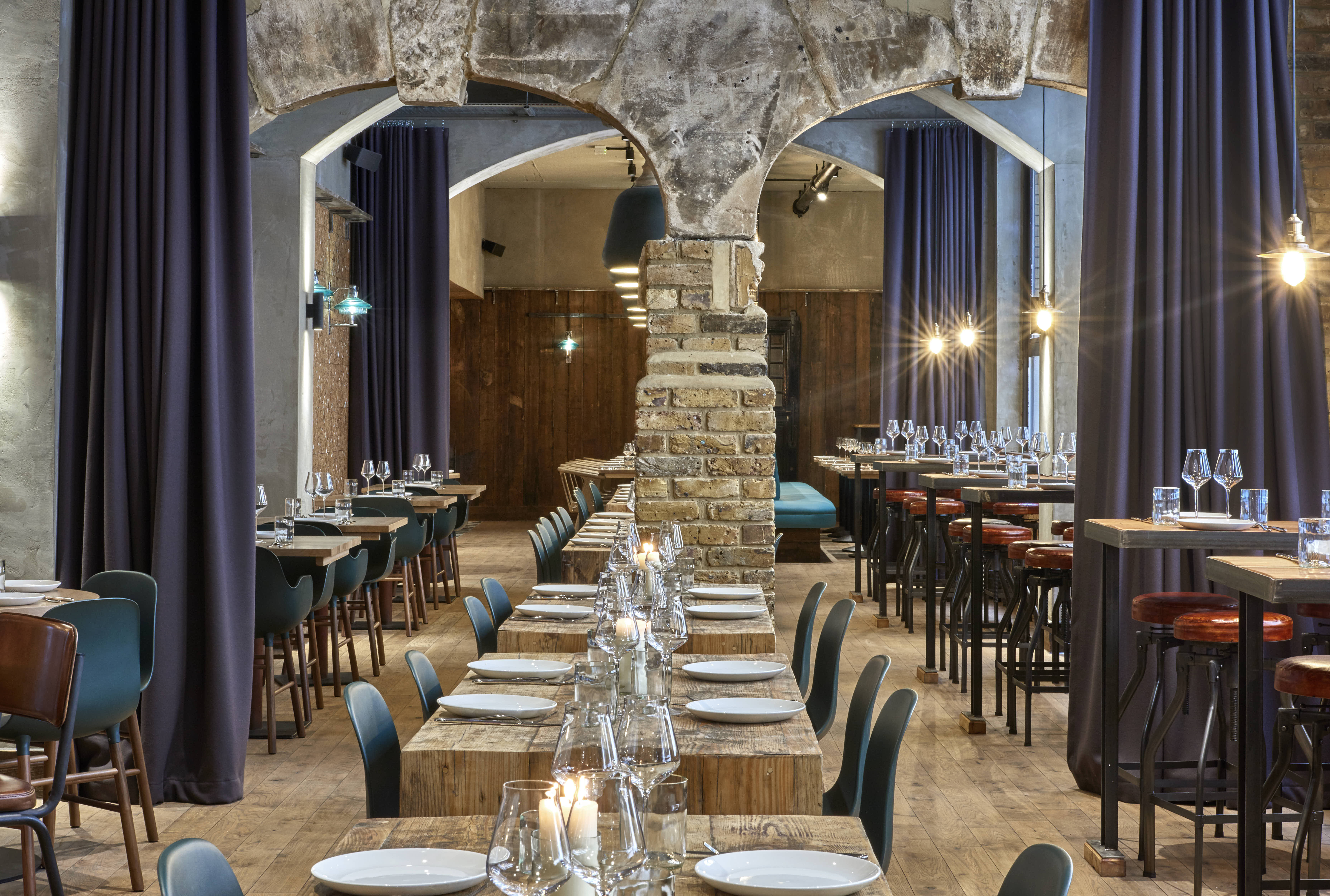 Stylish event space with rustic stone and modern decor at Humble Grape Fleet Street.