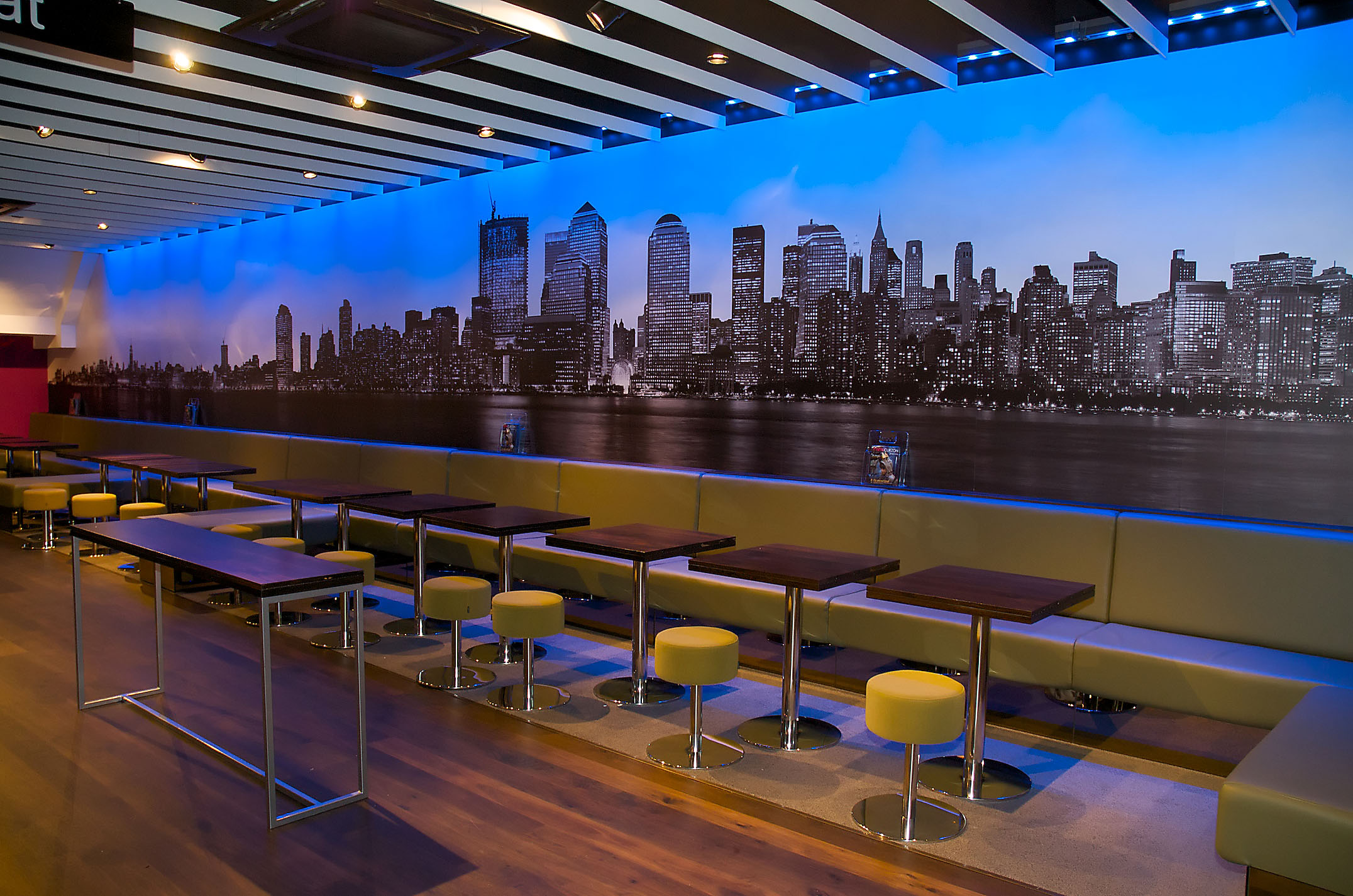 Modern event space in Curzon Wimbledon with skyline mural, ideal for networking events.
