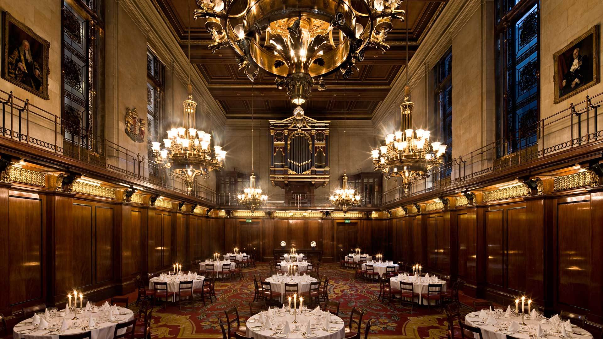 Elegant banquet hall with chandeliers, perfect for formal dinners and corporate events.