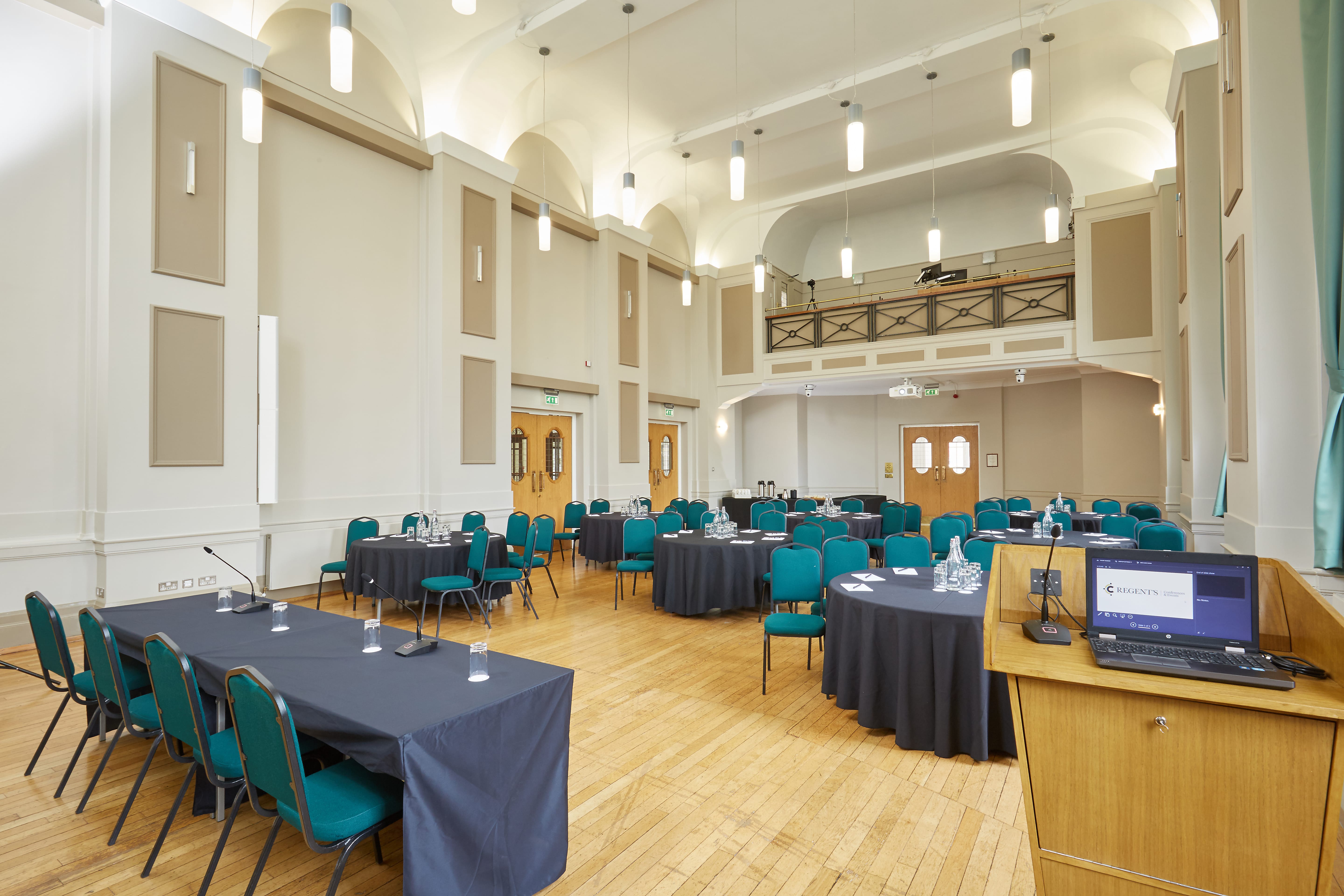 Herringham Hall event space with round tables, ideal for meetings and conferences.