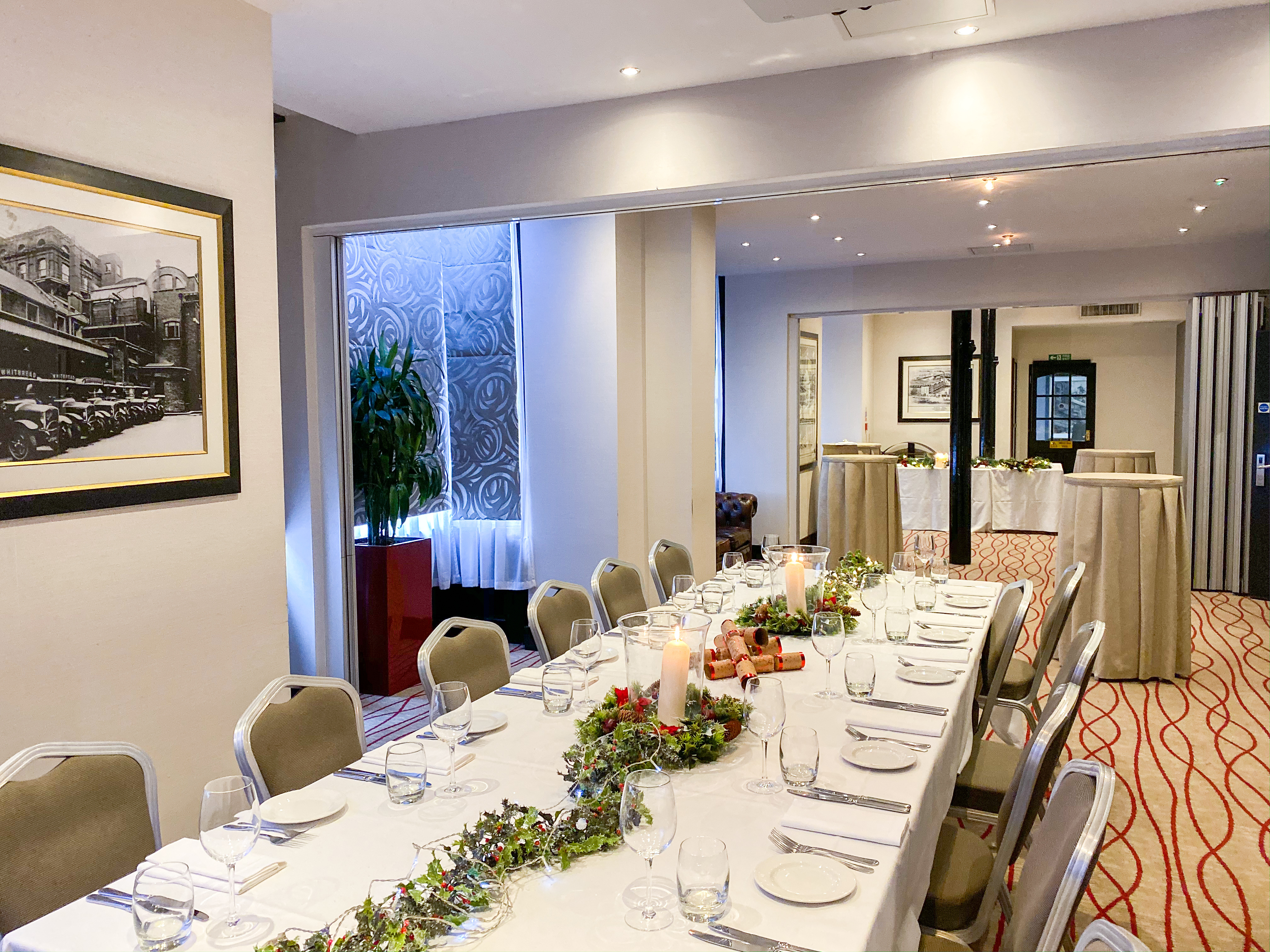 Elegant meeting space with long table, ideal for corporate events and private dinners.